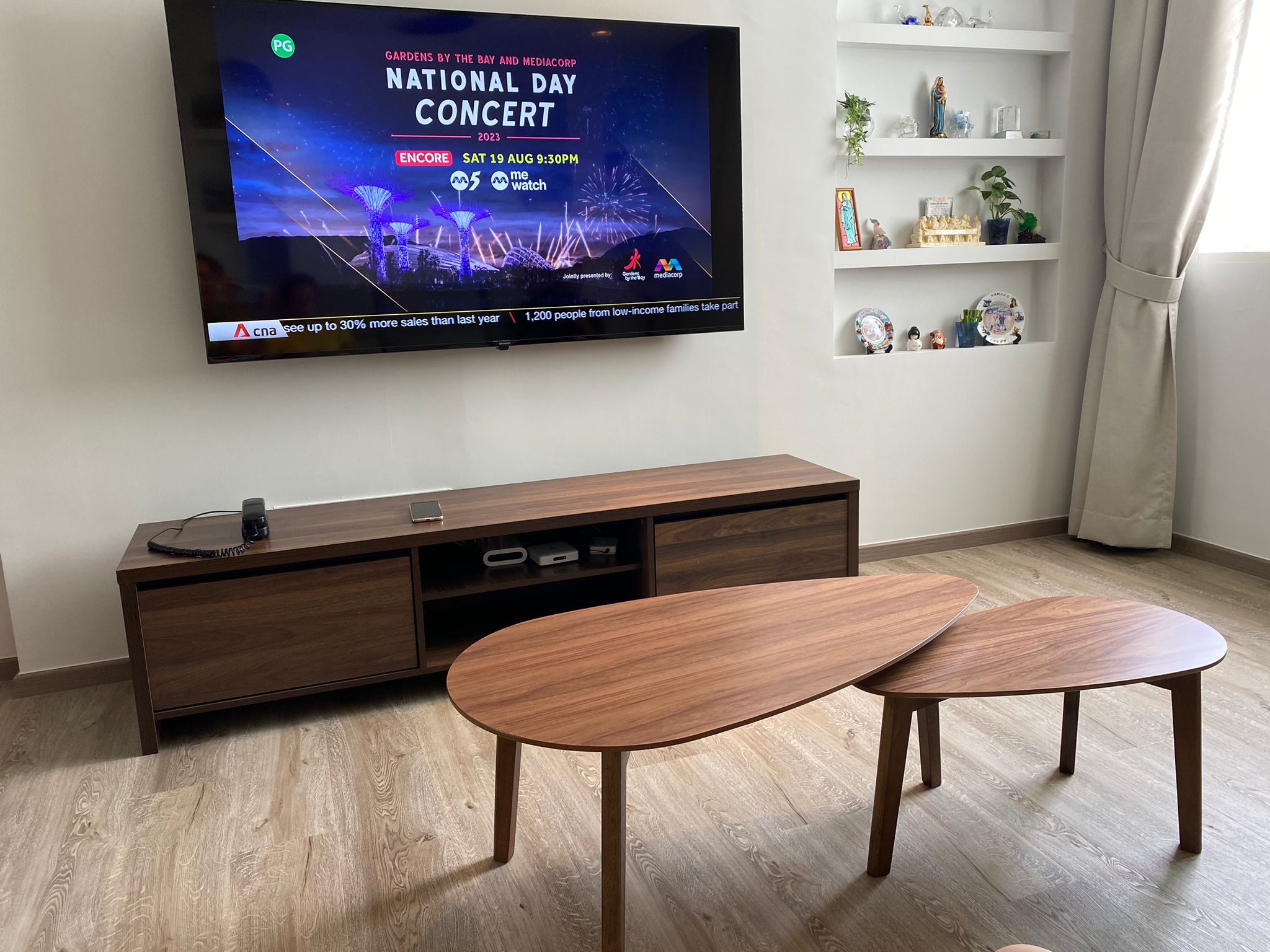 Customer home photo 2: Love the Byndi TV console! Nice walnut color in the elegant design.  Fit nicely below my 65inch TV!  Price is affordable and the delivery is as per schedule.  Highly recommend!