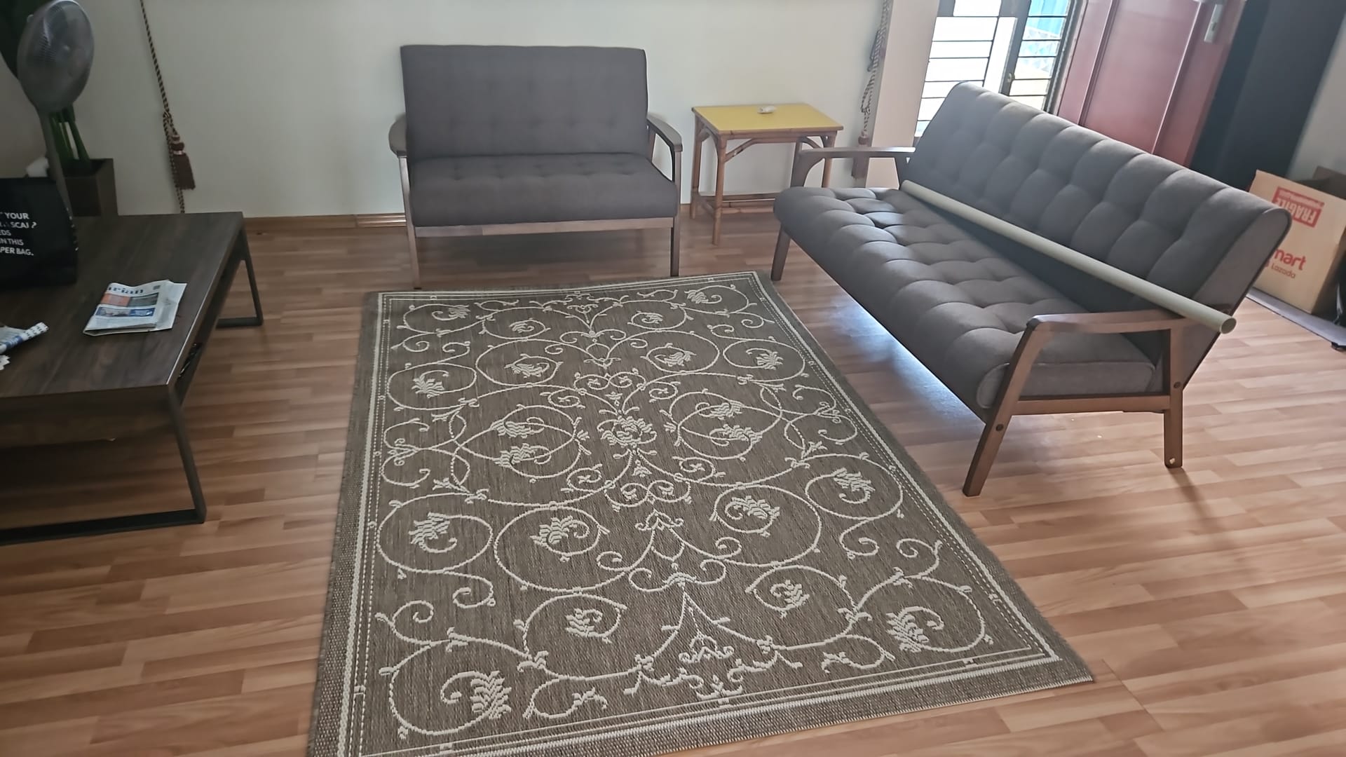 Customer home photo 2: Item came as described. The rug goes into shape immediately after unrolling.