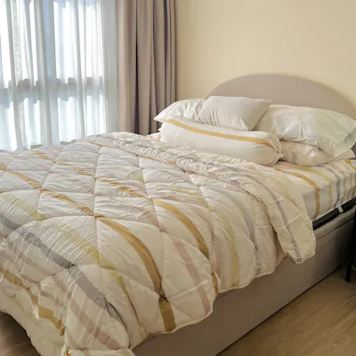Customer home photo 6: Loving the new bed frame. Matches my home’s aesthetic. Sturdy bed and can hold up very well even thought my mattress is very bulky. Just need a bit of strength when lifting up to access the storage.