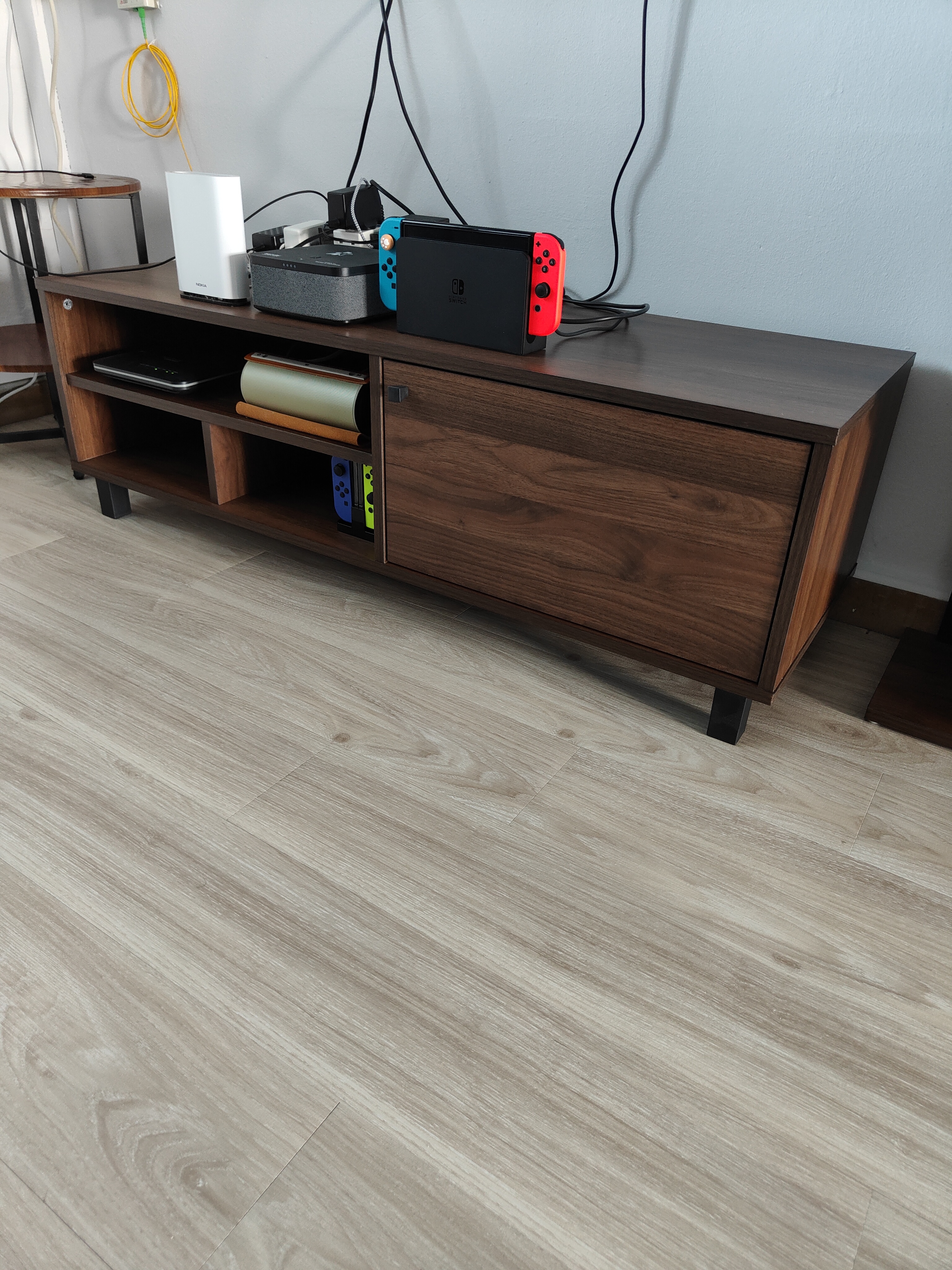 Customer home photo 6: Suitable for people that prefer low and non bulky tv console. Although small, able to place all my stuffs you can see in the photo. The side drawer is a plus point as most tv console with side drawer are very expensive. This is very affordable.