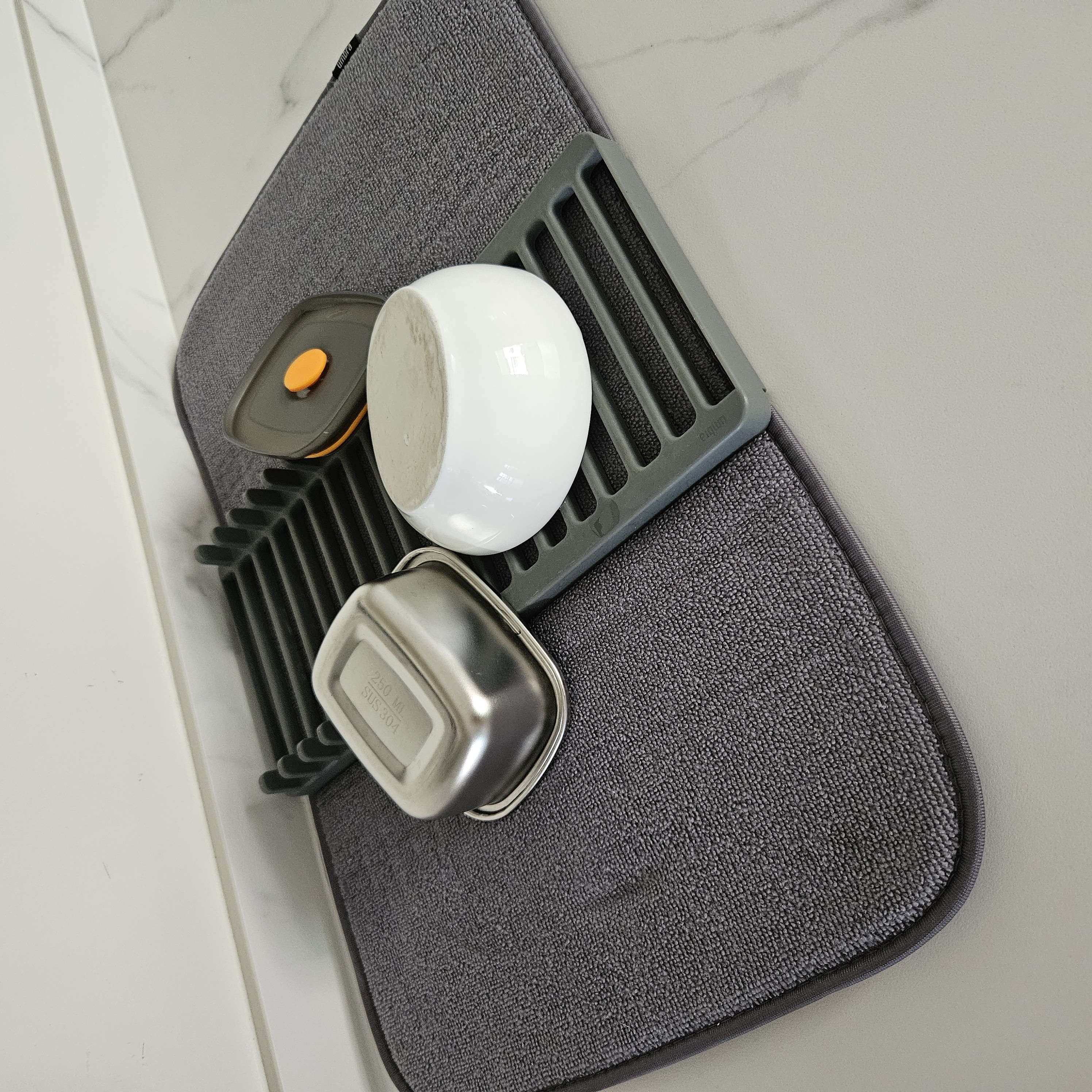 Customer home photo 2: Love this drying mat, very convenient and functional.  Fold and keep it in drawer when not in use, saves kitchen space.  Very long lasting, been using thus for a few years already and yet it still looks new.