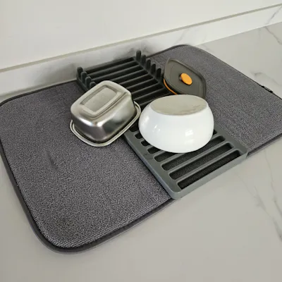 Customer home photo 2: Love this drying mat, very convenient and functional. Fold and keep it in drawer when not in use, saves kitchen space. Very long lasting, been using thus for a few years already and yet it still looks new.