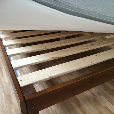 Customer home photo 7: It’s been a month and I’m happy with this affordable and simple but sturdy bed frame for tight spaces. Great buy!