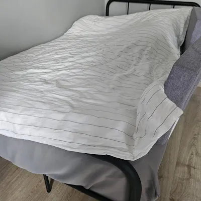 Customer home photo 1: There was an update of detailed delivery timing in the days leading up to the delivery date which I appreciate very much. The delivery guys came within the time frame stated, although it was the last 5min. The guys were polite and neat, and worked quickly to set up the bed. They cleaned up the space after they're done too. The bed is powder coated, so hopefully that'd help with the rust issue. It is sturdier than I'd expected, and my child really enjoyed staying in it. That said, I was a bit sad cos when I 1st wanted to buy it was $80, and then a week later, the price almost doubled.