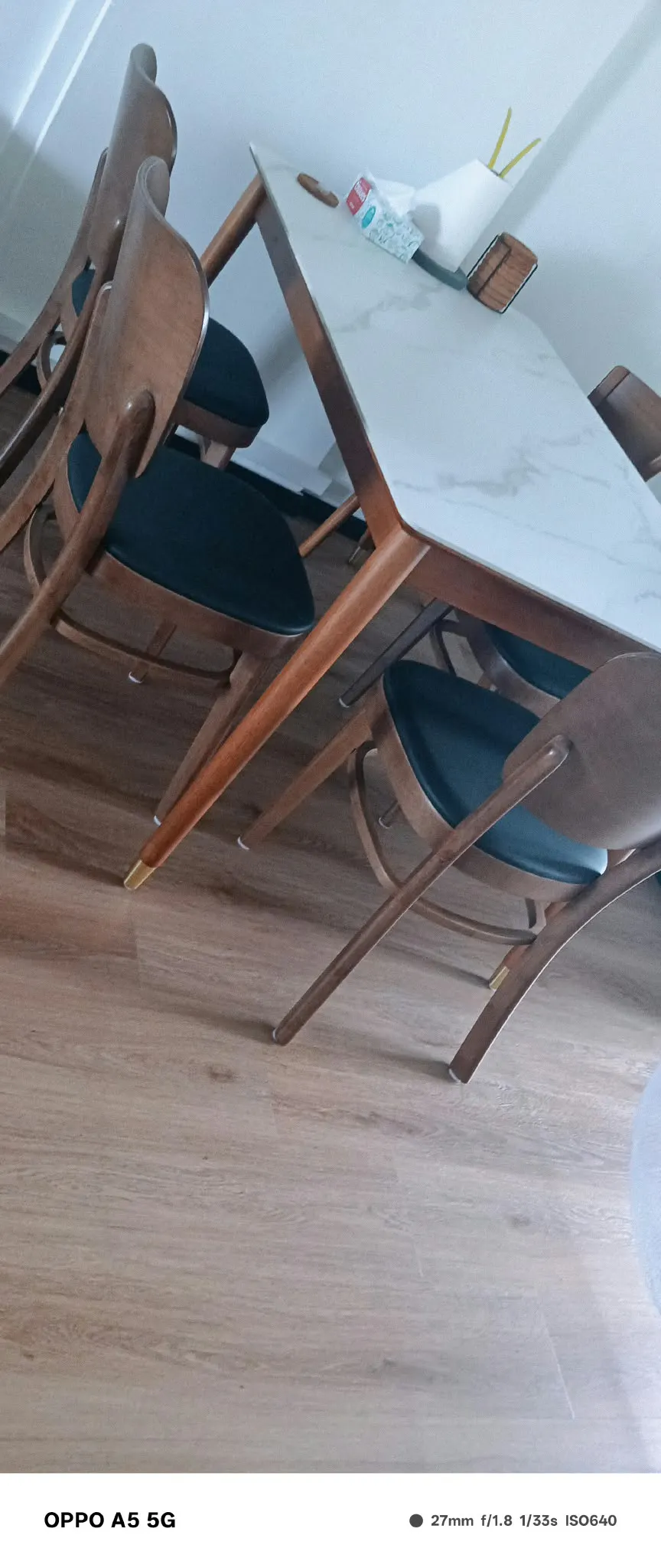 Customer home photo 1: I like the modern design of this dining chair at an affordable price. The purchase process was a breeze and smooth delivery!