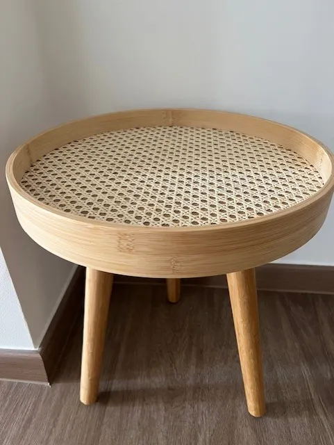 Customer home photo 2: I bought this to match my TV console and they fit perfectly together. The table is compact and pretty.