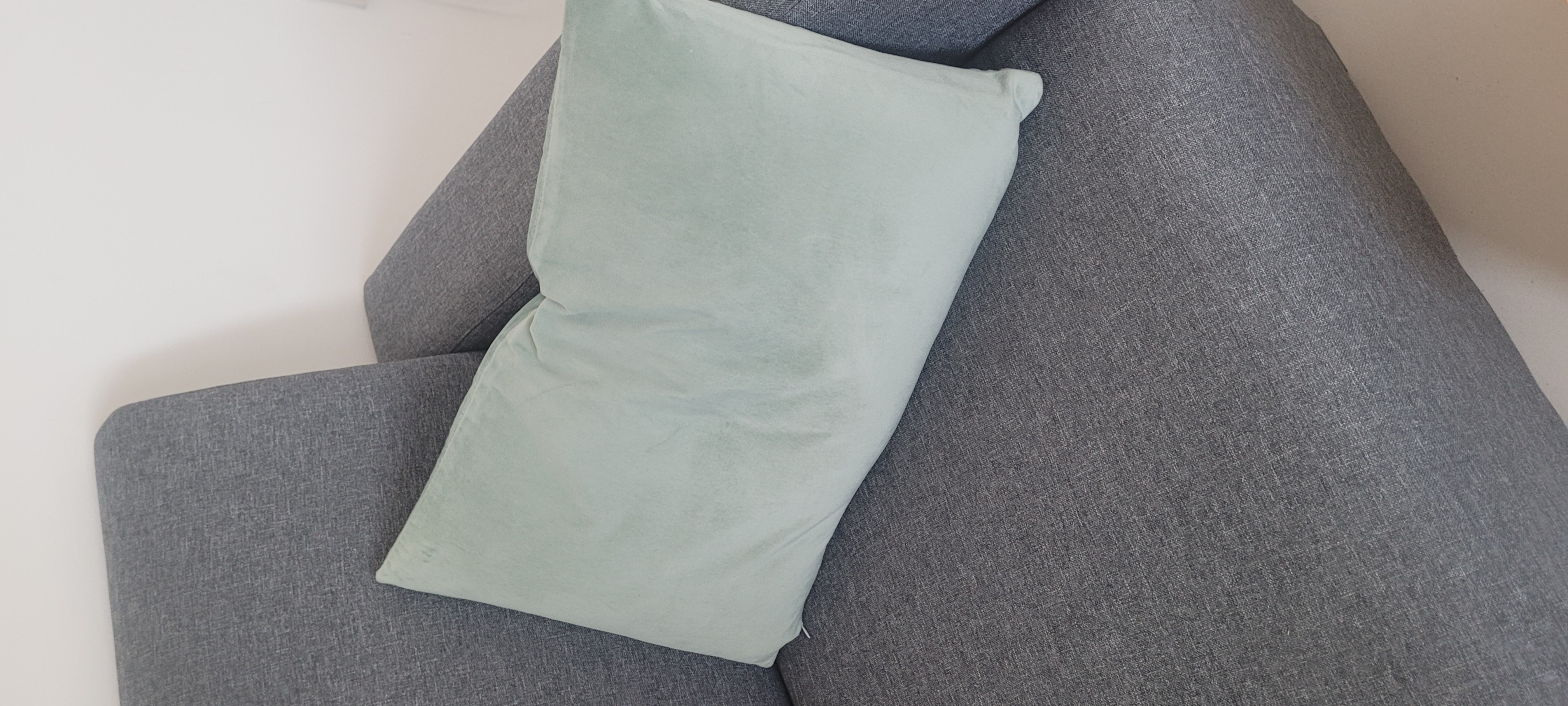 Customer home photo 3: Good Cushion cover that is very soft. It will not machine wash well. However it look great.