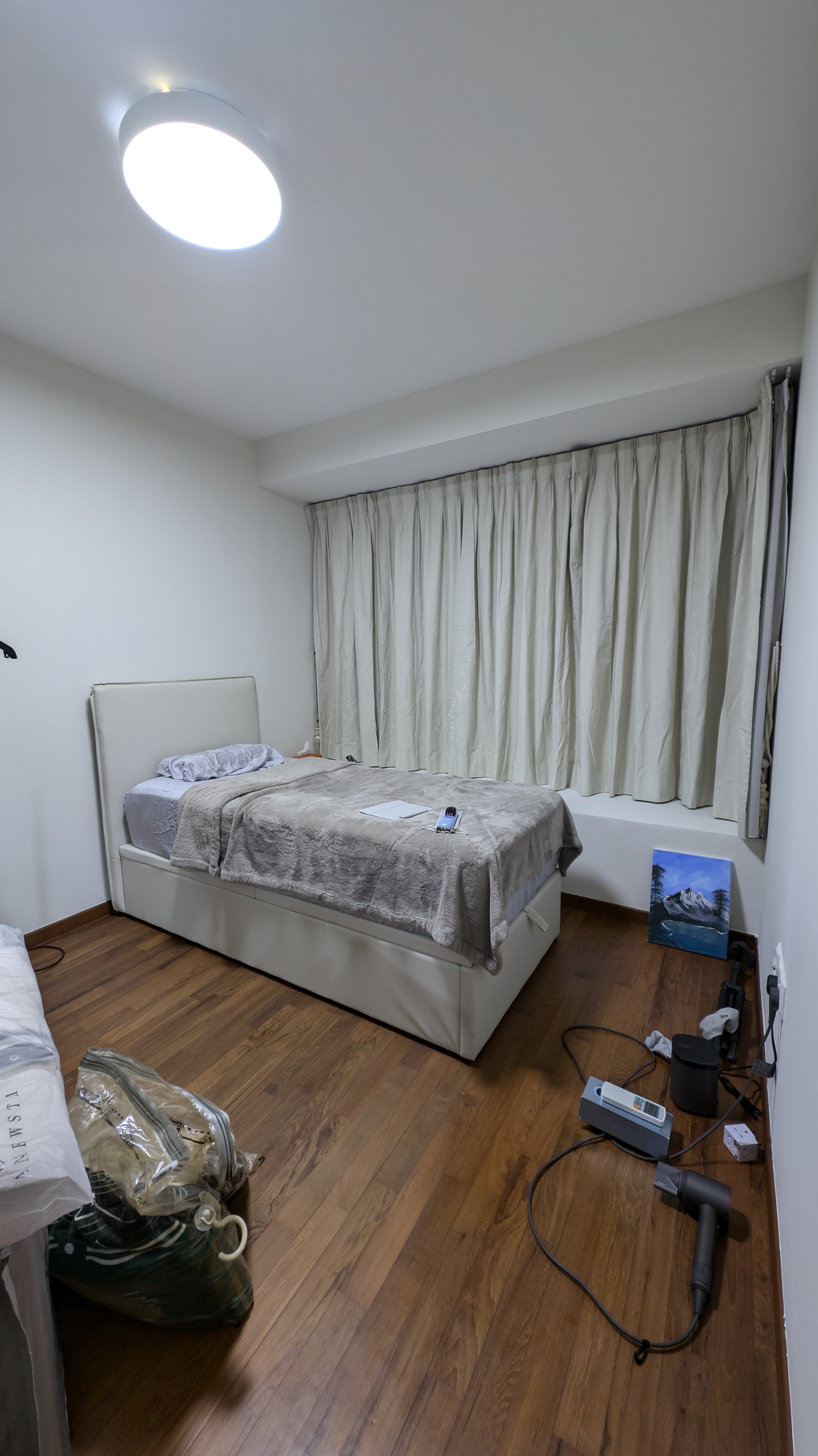 Customer home photo 1: Mechanism works well. Storage is spacious. It just has 3 stands in the middle that prevents you from putting check in size luggages.