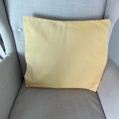 Customer home photo 12: Cushion insert has serves us well for over three years now! Paired it with the Hipvan yellow cushion cover and has lasted beyond expectations.