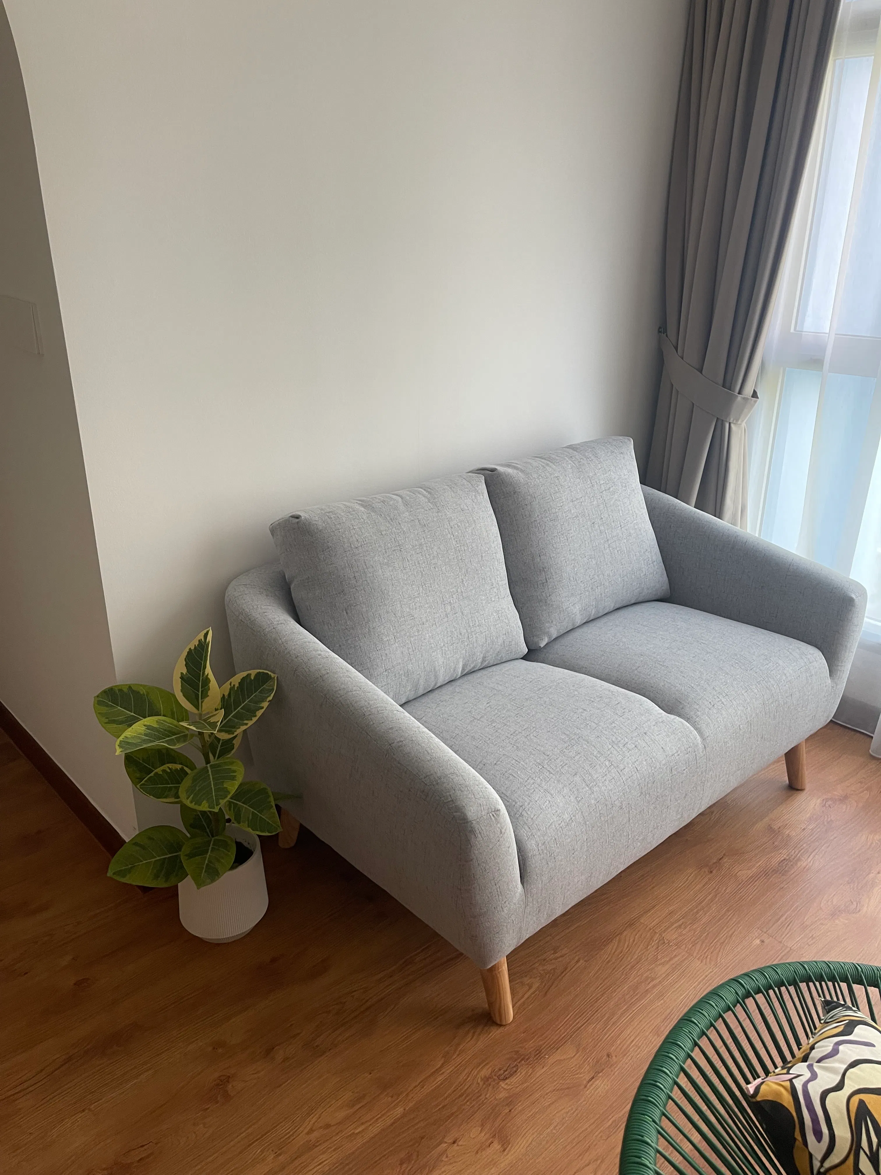 Customer home photo 14: This exceeds my expectations in terms of appearance and quality. I like the seat depth that suits my short legs. It is comfortable and nice looking in a small living room.