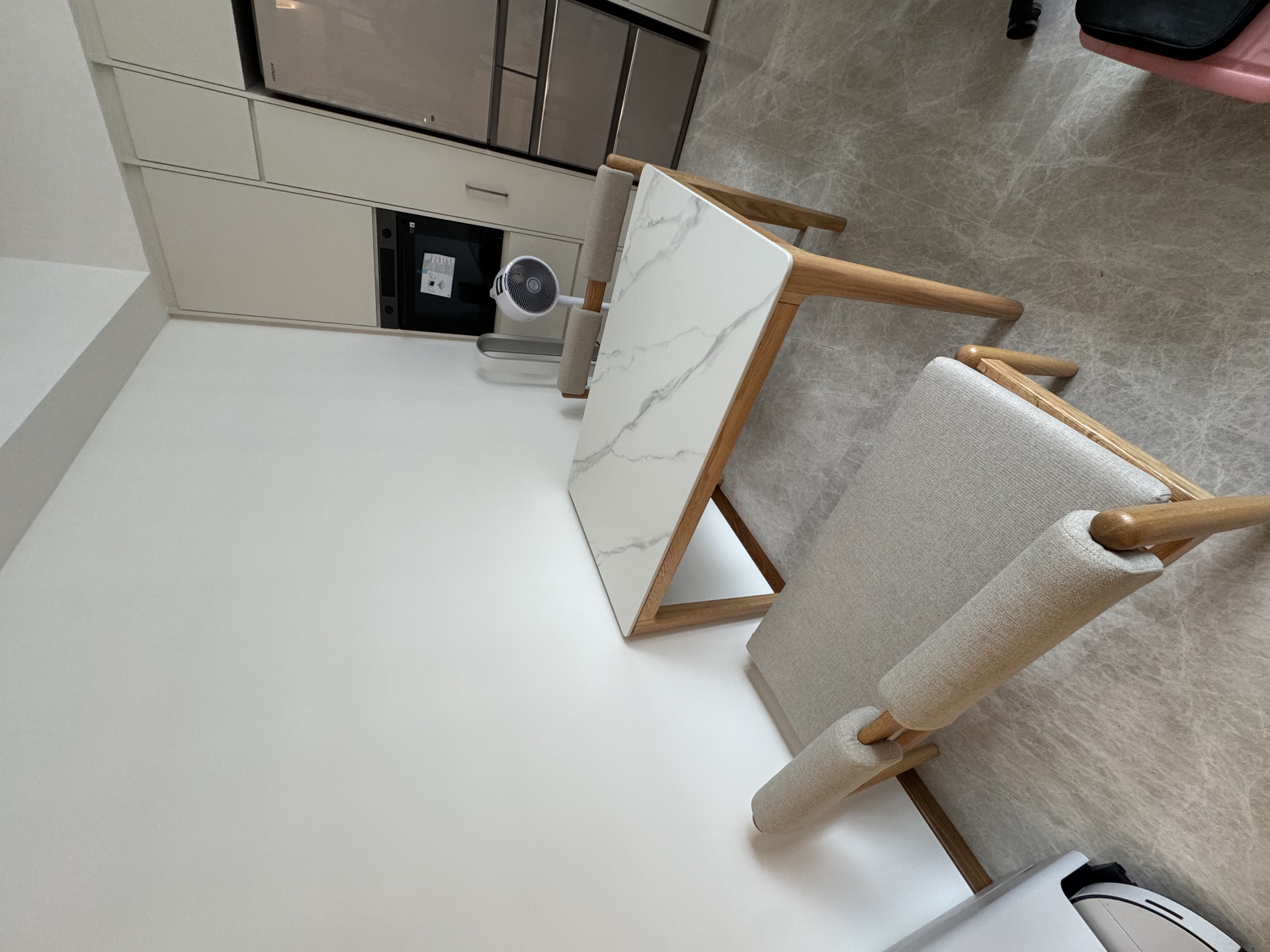 Customer home photo 2: Bench seats that slide and fit perfectly under the table when not in use.  The bench seat also allows one to place the leg on it with back against the wall - very comfortable.  Quality is good. Glad to find this in Hipvan.