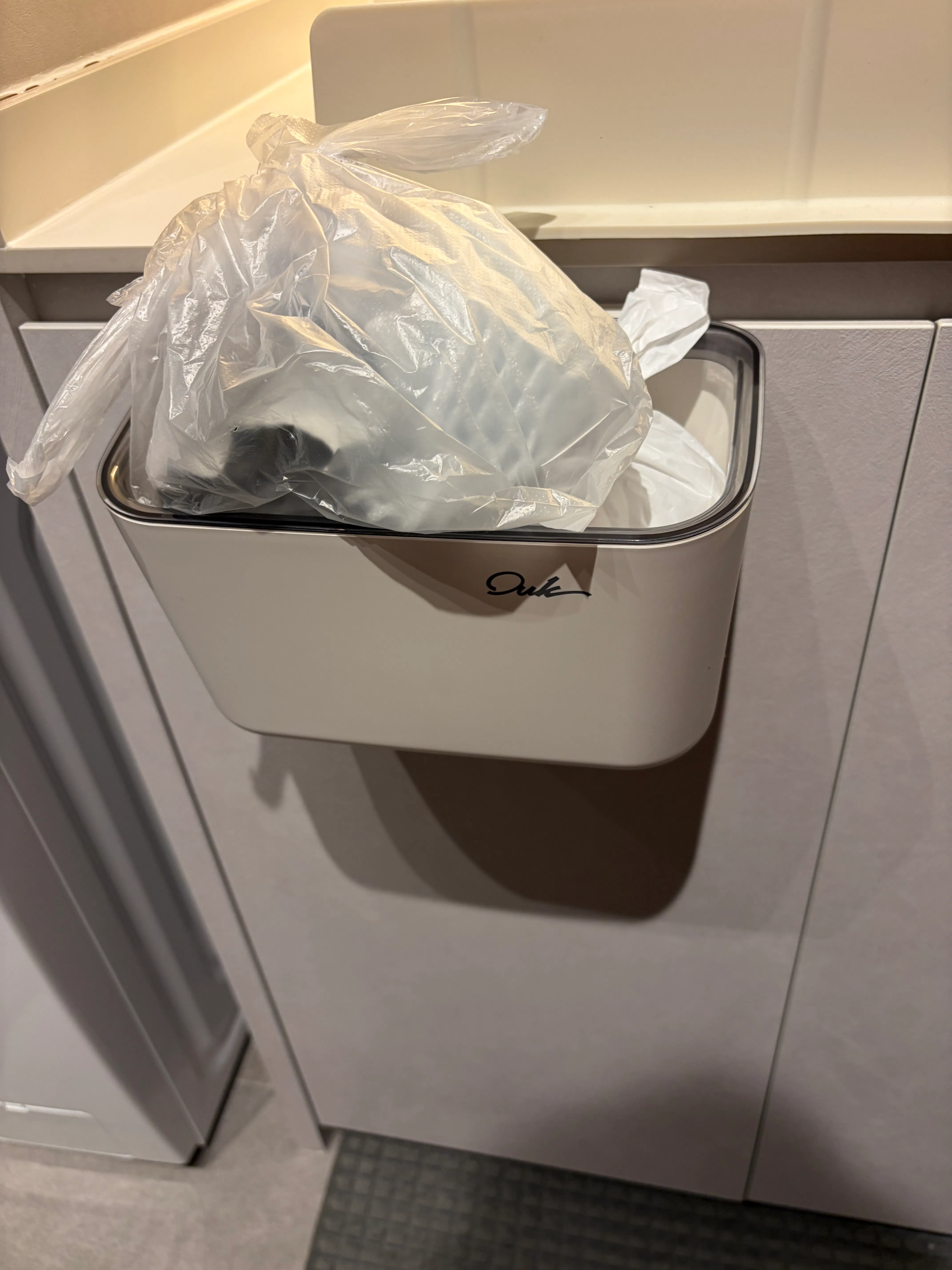 Customer home photo 1: This waste bin fits well and is useful, the size is ok since I am living alone