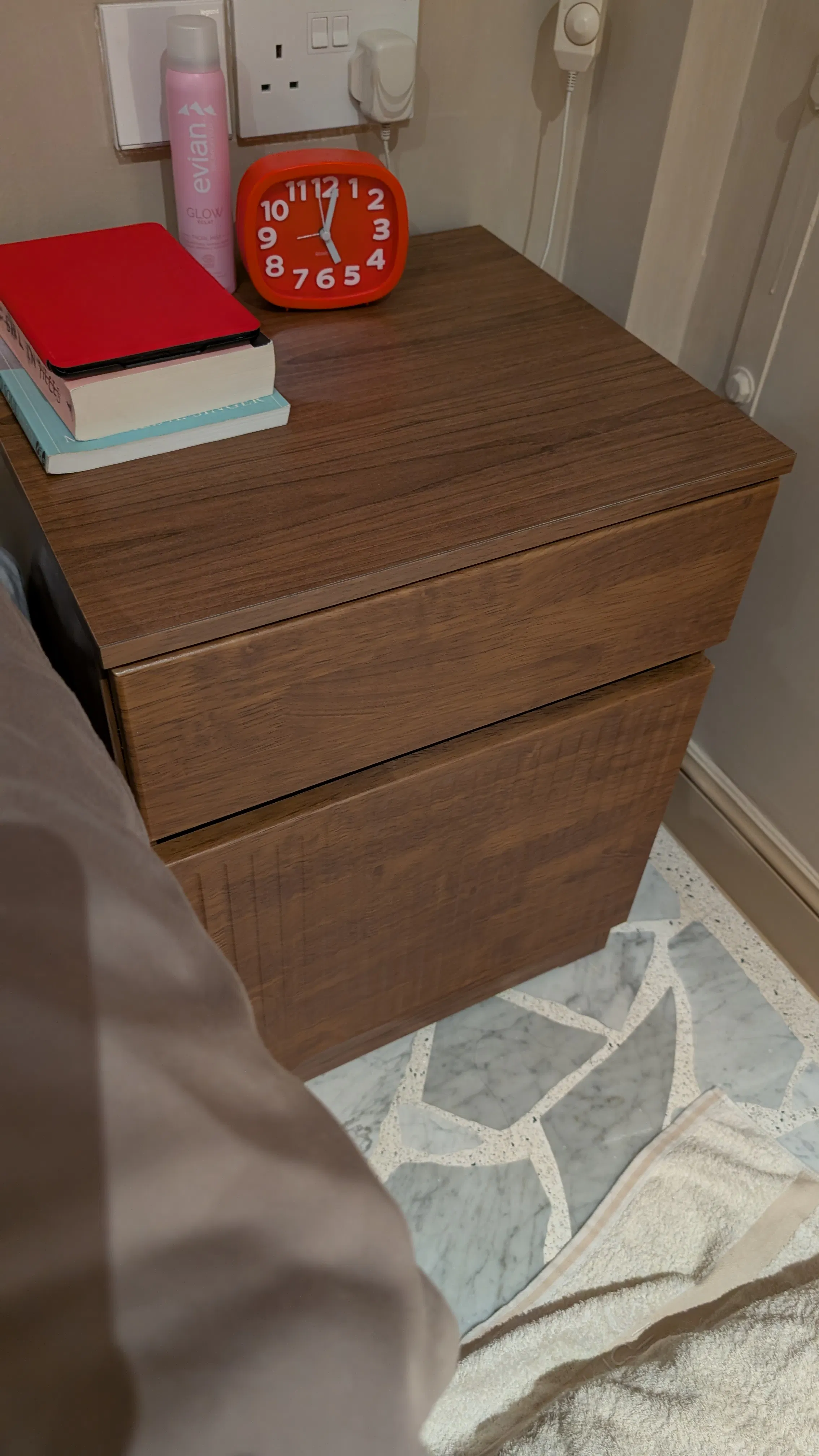 Customer home photo 16: Took me a while to find a bedside table with a drawer and a cabinet. This is a good sized solid piece which I'm happy with. Minus one star for having a big gap between the door which allows dust and fur to get in