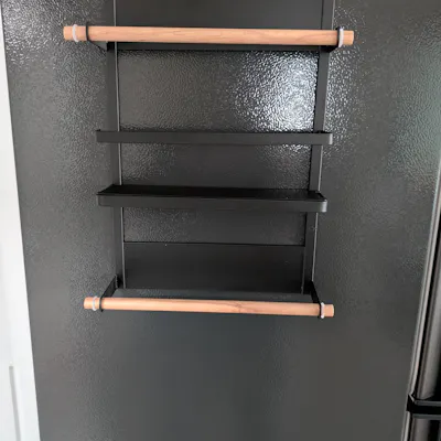 Customer home photo 1: the rack sticks strongly as a magnet to your fridge.