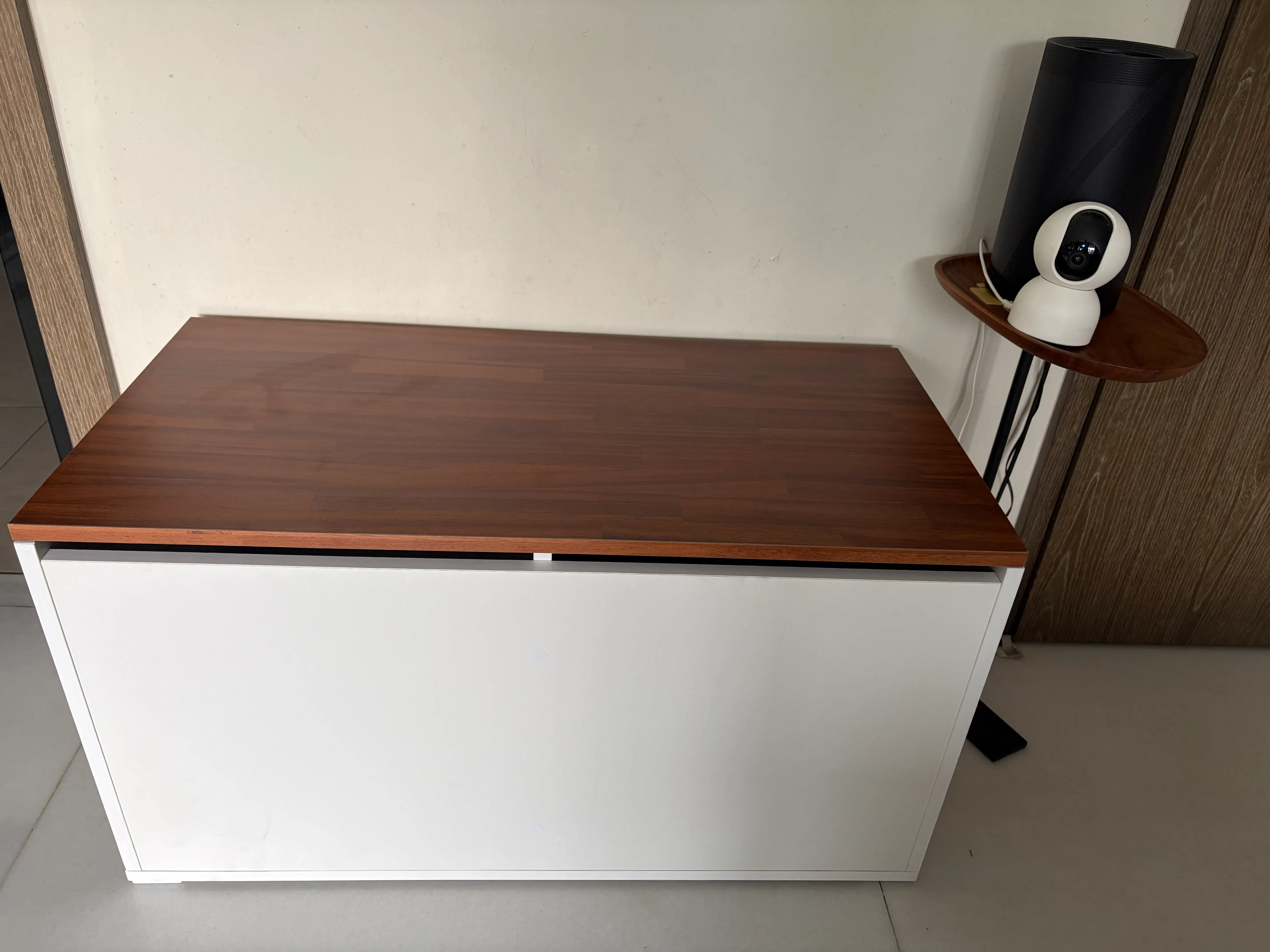 Customer home photo 1: Liked the simple but practical design and the dio color with the wood top was a clincher. It also had a few sizes in length which allowed me to pick one perfect for my spot. The delivery tine was ok in terms of how long before delivery, that could improve.  But two thumbs up for managing a time slot. They actually narrow it down to a specific hour the day before for delivery and were on time and efficient! I really appreciated that.