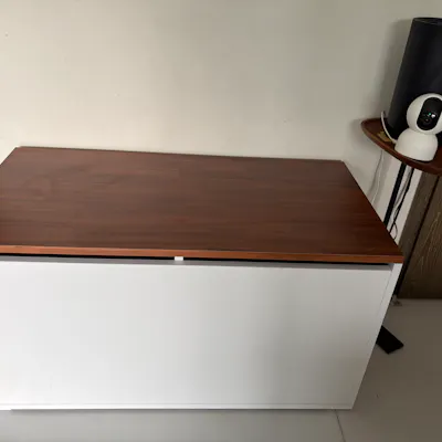 Customer home photo 1: Liked the simple but practical design and the dio color with the wood top was a clincher. It also had a few sizes in length which allowed me to pick one perfect for my spot. The delivery tine was ok in terms of how long before delivery, that could improve. But two thumbs up for managing a time slot. They actually narrow it down to a specific hour the day before for delivery and were on time and efficient! I really appreciated that.