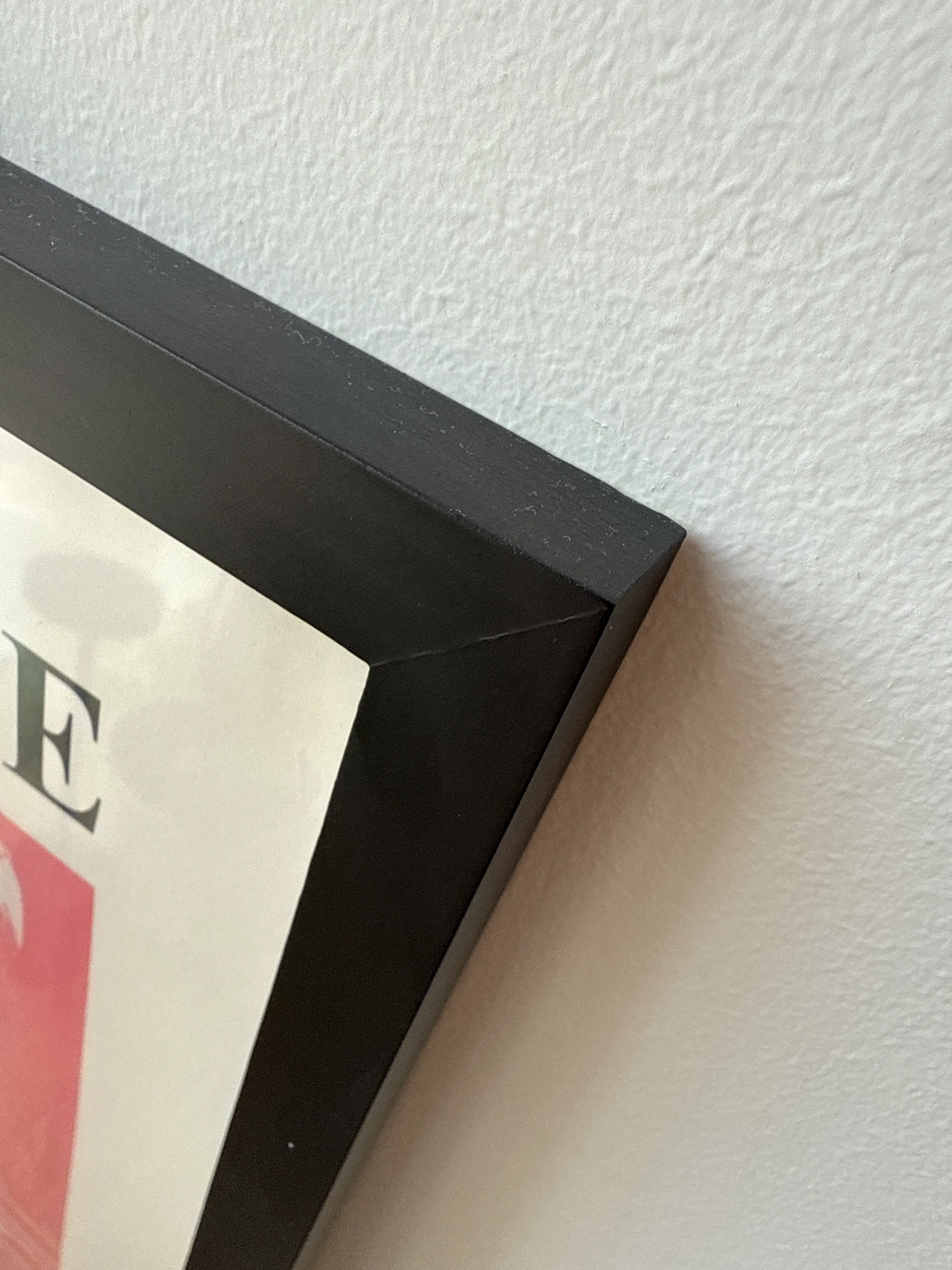 Customer home photo 7: Nice frame. Light weight. Good price. Wish the bezel was a bit thinner though. It’s a wood frame. Quality is ok for the price.