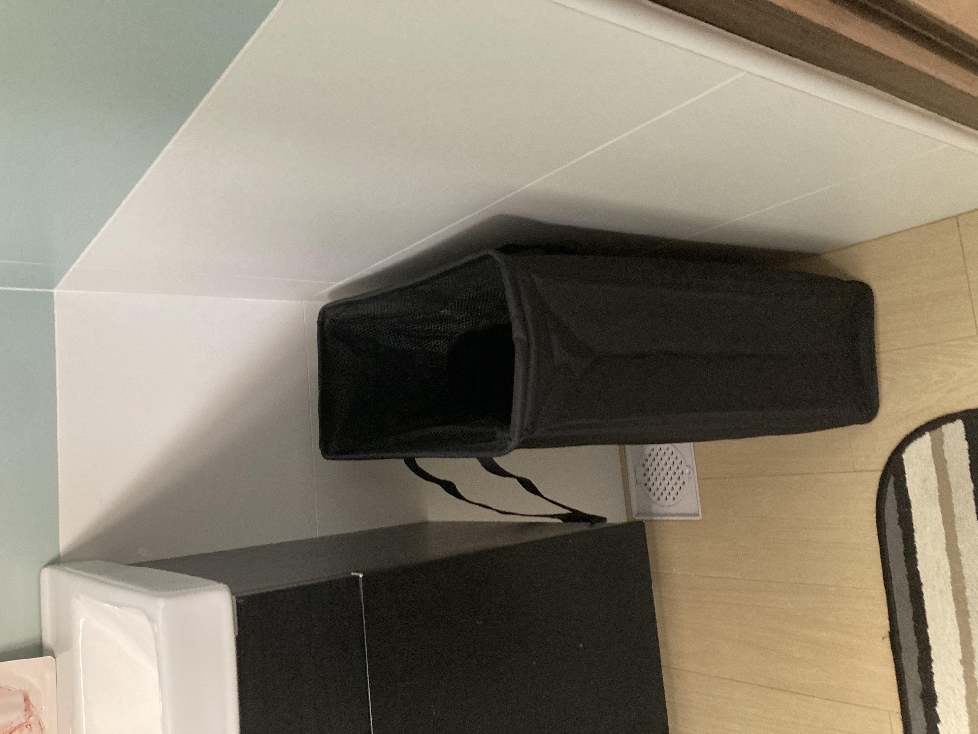 Customer home photo 6: Great for placing in small narrow spaces where other laundry baskets cannot fit