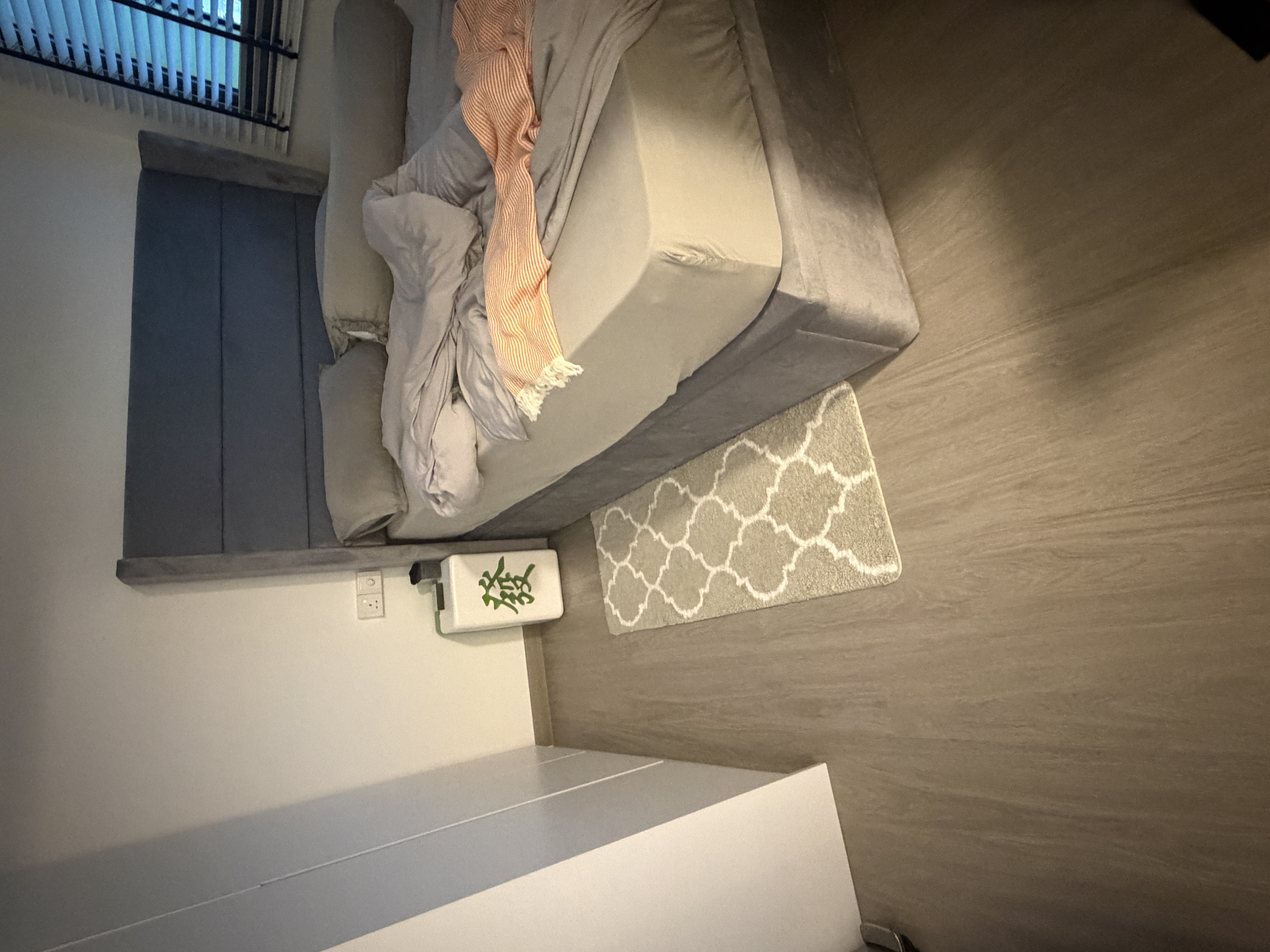Customer home photo 4: This rug is soft to the touch and adds a light touch to my bed room