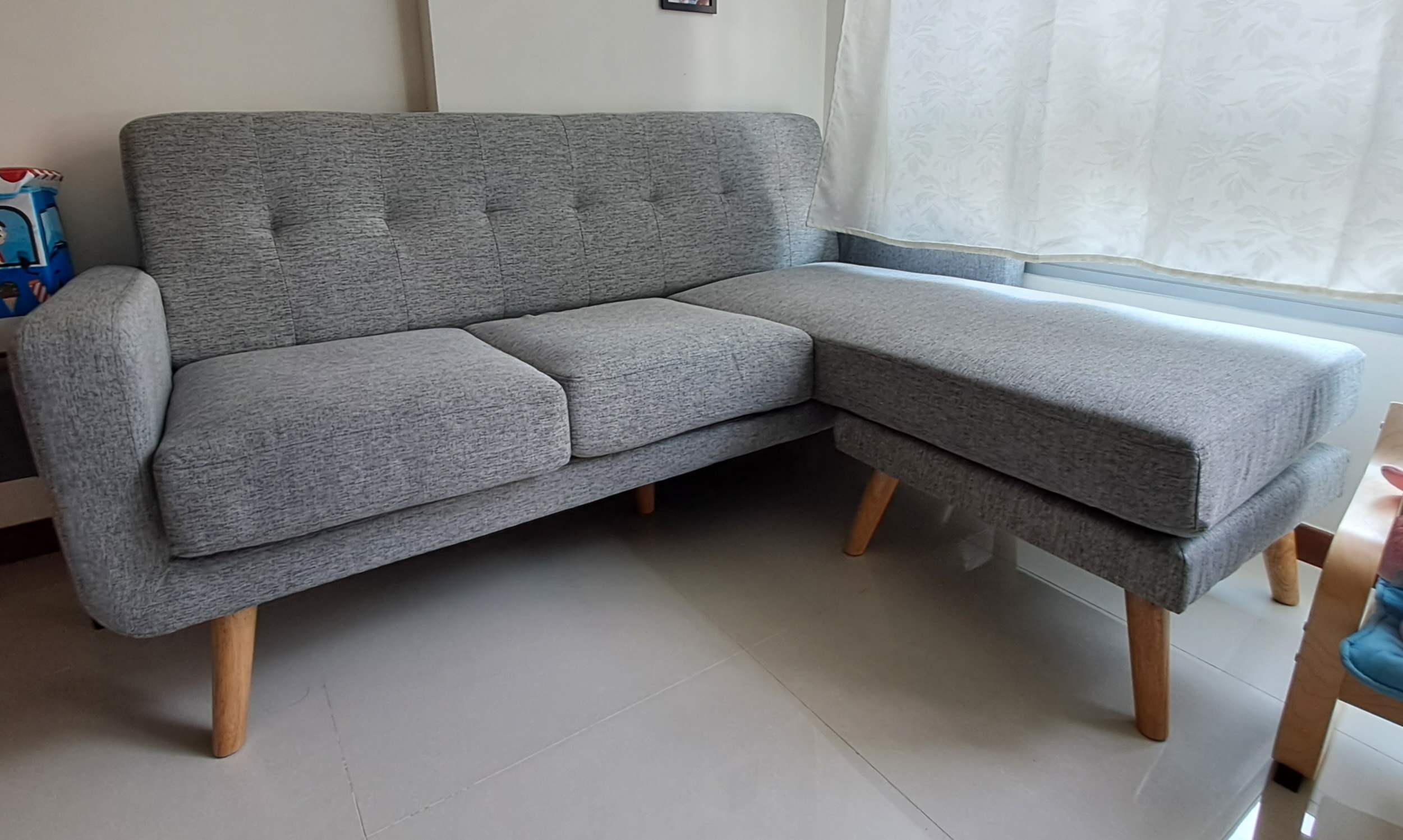 Customer home photo 17: True to the picture. Tried and tested at the shop. This sofa is definitely more spacious for the butt as compared to my previous one. Pretty comfy where I can even lie down and take my naps. Got this at 30% discount!