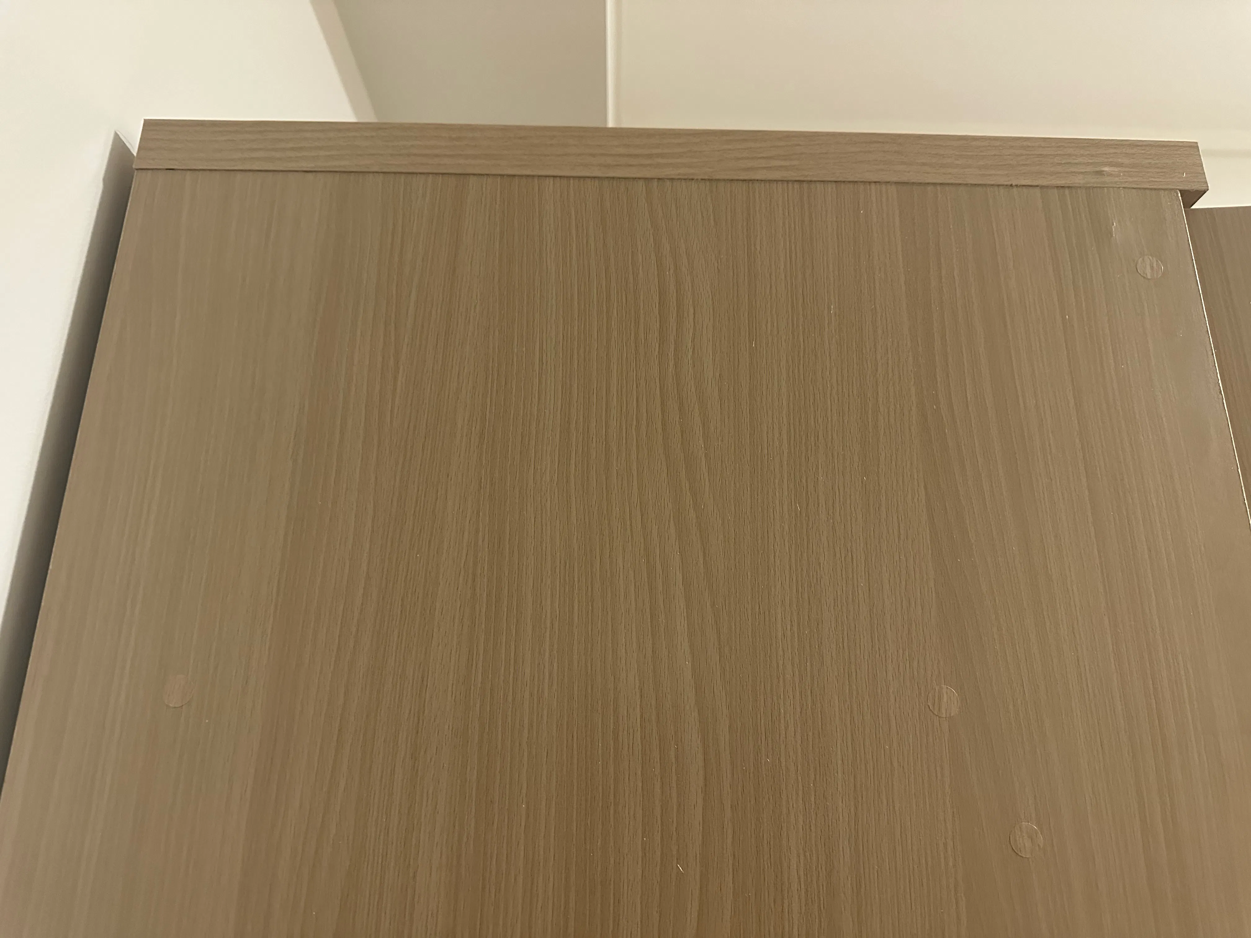 Customer home photo 1: The cupboard has a few stickers, likely used to cover some defects. Overall, it’s still better than my 3-door cupboard.