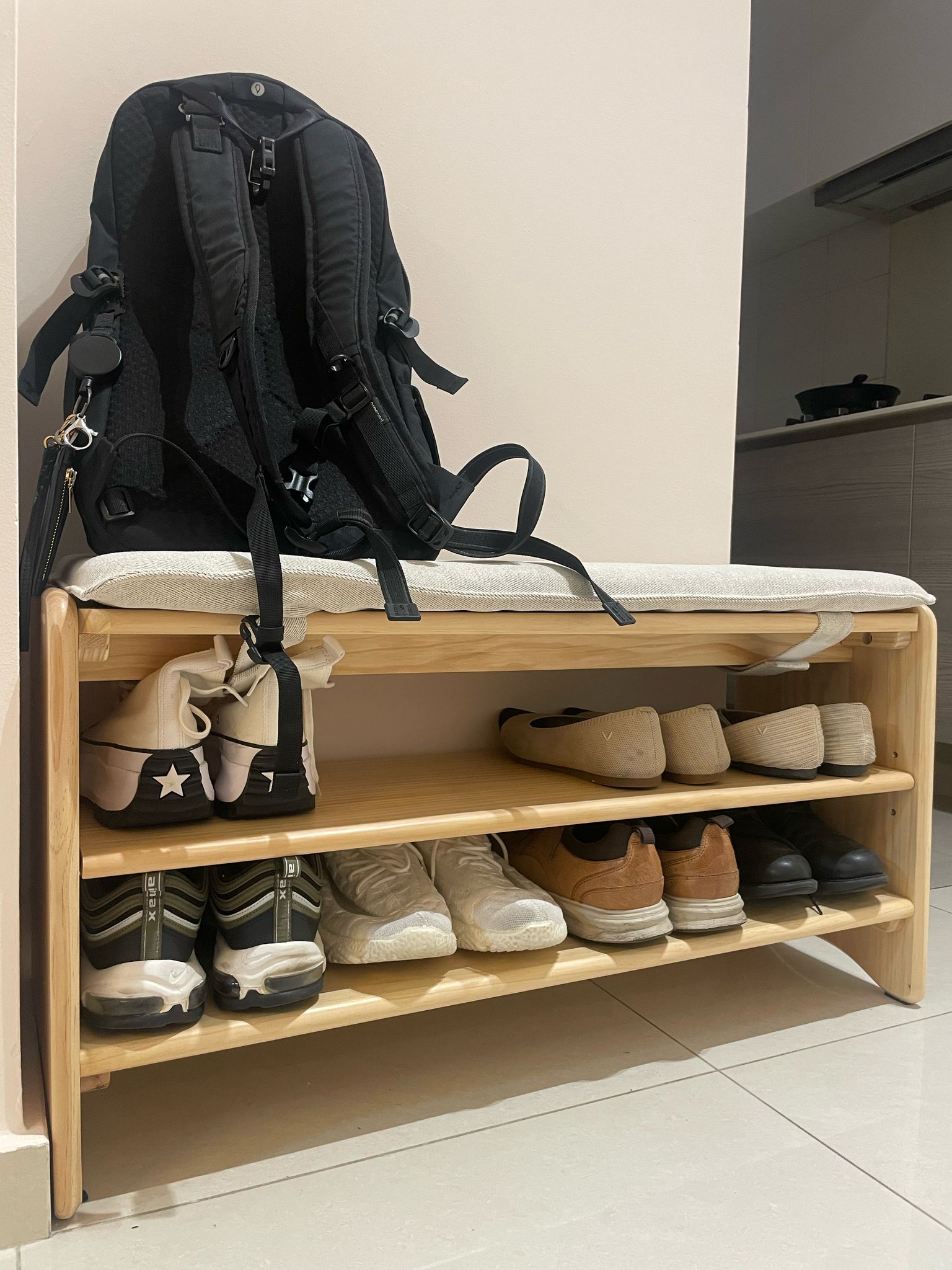 Customer home photo 3: This Scandinavian design shoe rack with seat is great! It easily fits 8+ pairs of shoes and is a stylish and practical addition.