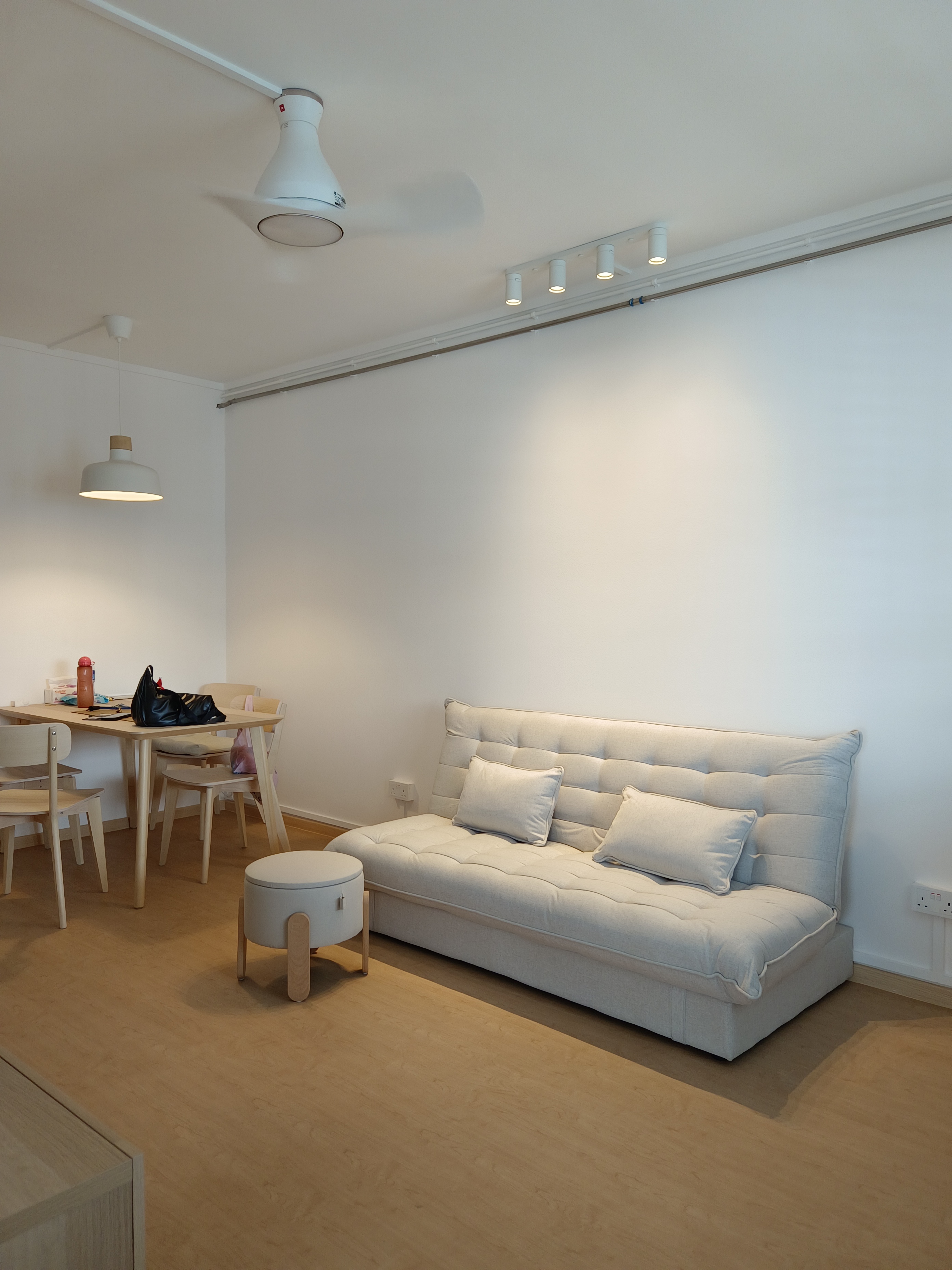 Customer home photo 6: The sofa is light and easily movable. It is not too bulky and fits my 3 rm HDB living room with space left for a coffee table. The firmness is just right. Too bad the cover is not washable but I can put a sofa cover over it anytime. The sofa is wide enough for three adults.