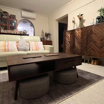 Customer home photo 5: Love the herring bone design of the cabinet and the fact that it’s off the ground to put the more commonly worn shoes below it. Has the Balinese furniture feel.