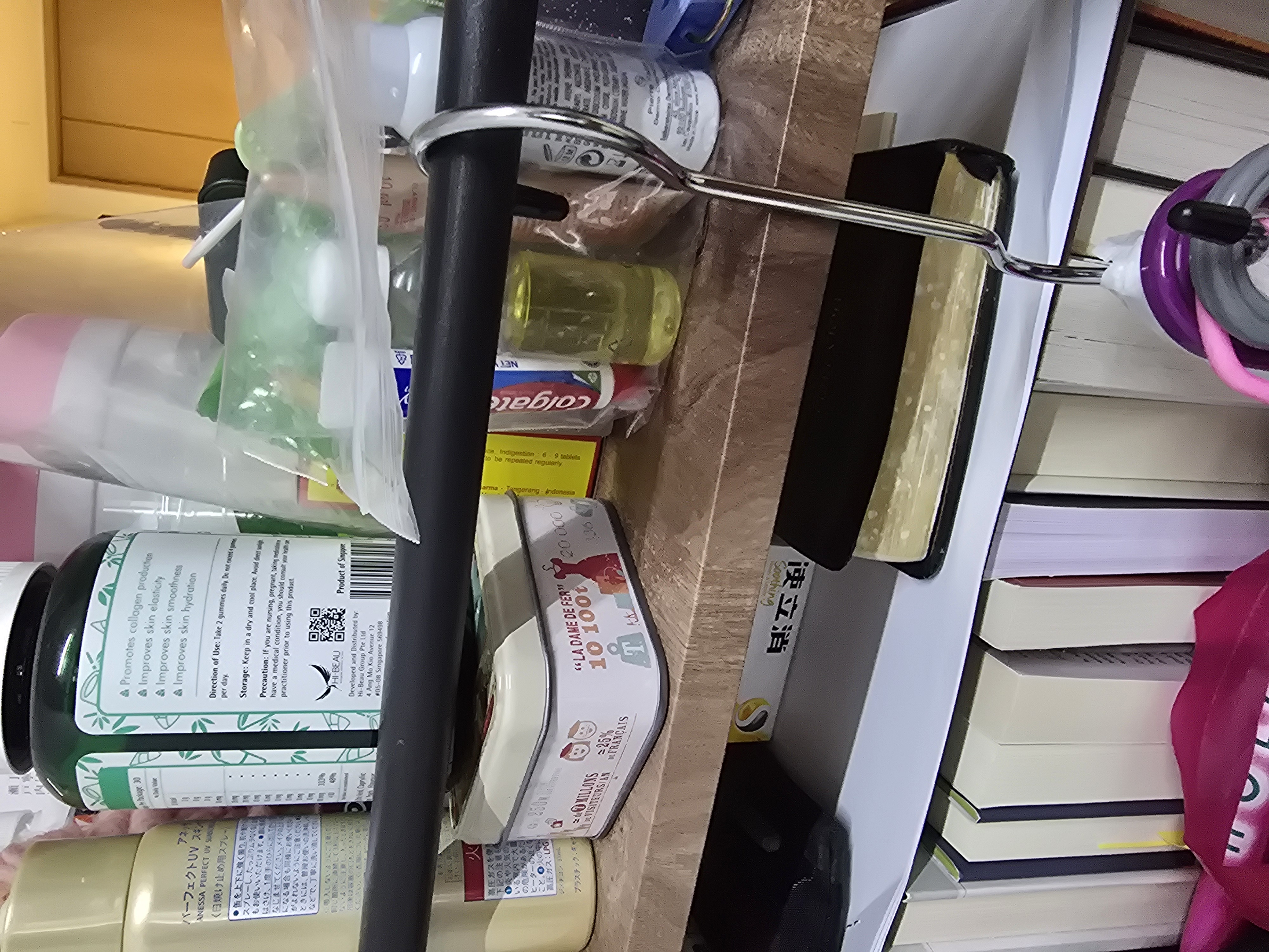 Customer home photo 1: This is a compact table and serves its functions. I like the strong bars which allow me to hook items