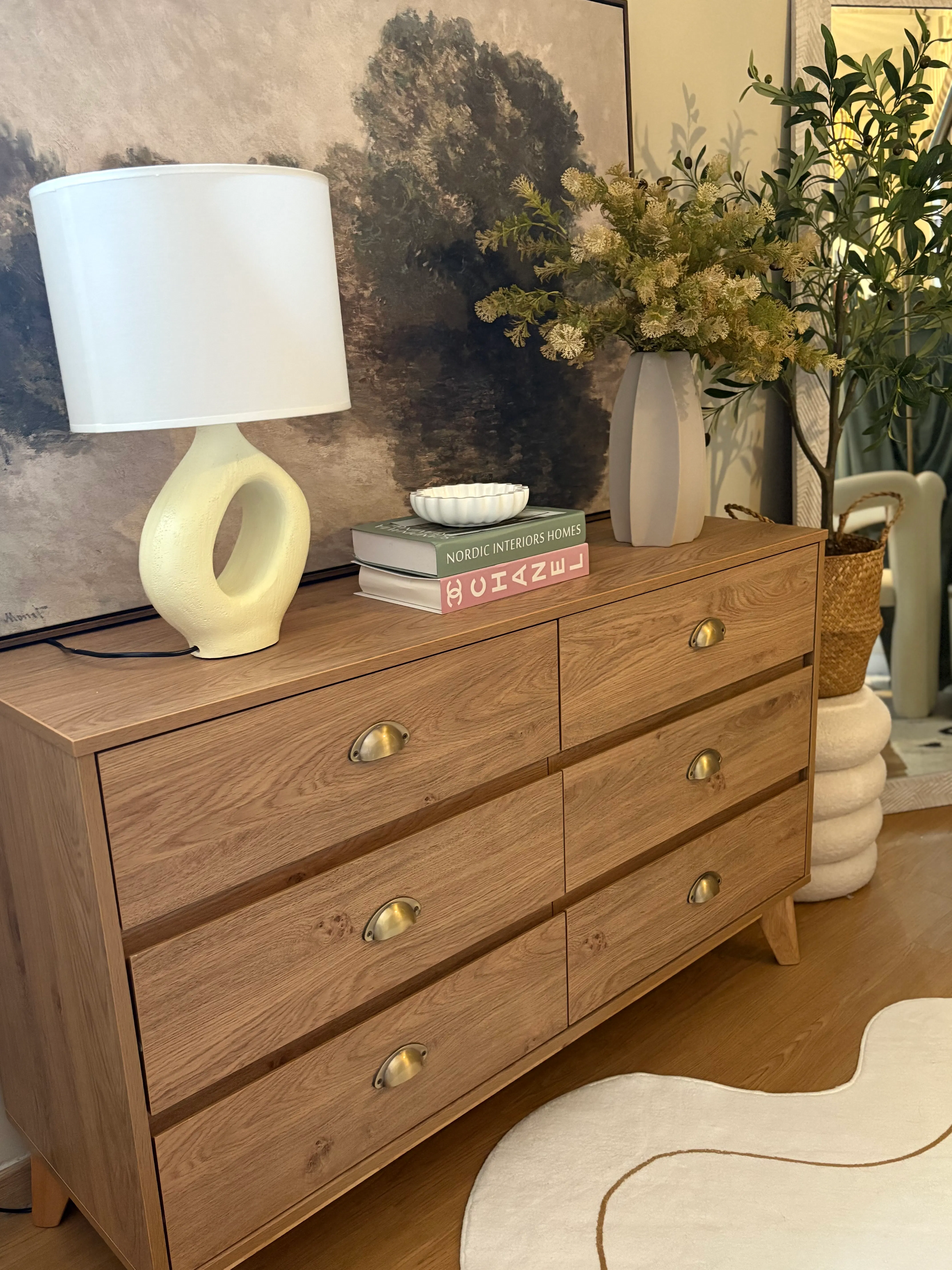 Customer home photo 1: I absolutely love the tone of woody grains laminate used on this chest of drawers. We also personally added brass handles to complete the look. I have no regrets buying this!😍