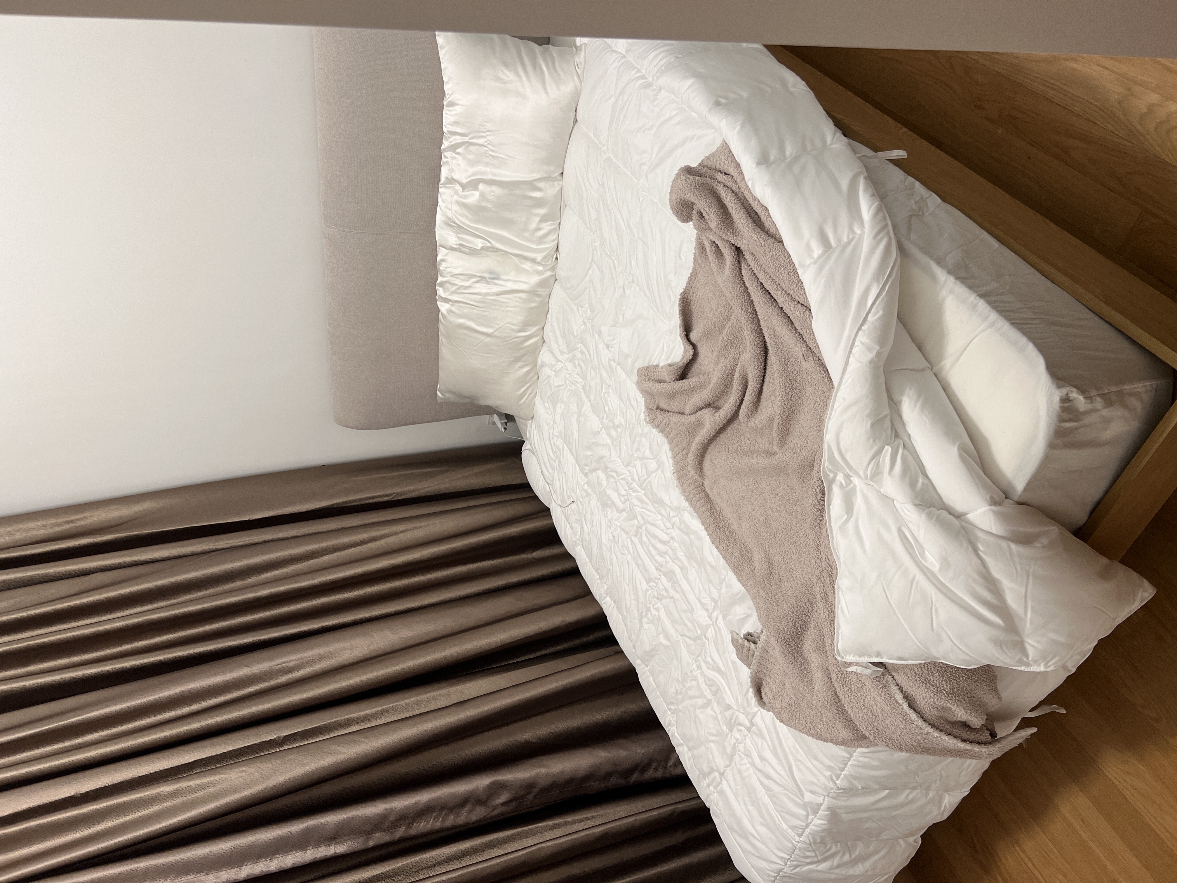 Customer home photo 7: It’s a little lower overall than I expected but otherwise it’s great. I like the material of the headboard & that you won’t stub your toe on legs. Assembly was quick & easy as well