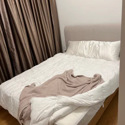 Customer home photo 8: It’s a little lower overall than I expected but otherwise it’s great. I like the material of the headboard & that you won’t stub your toe on legs. Assembly was quick & easy as well