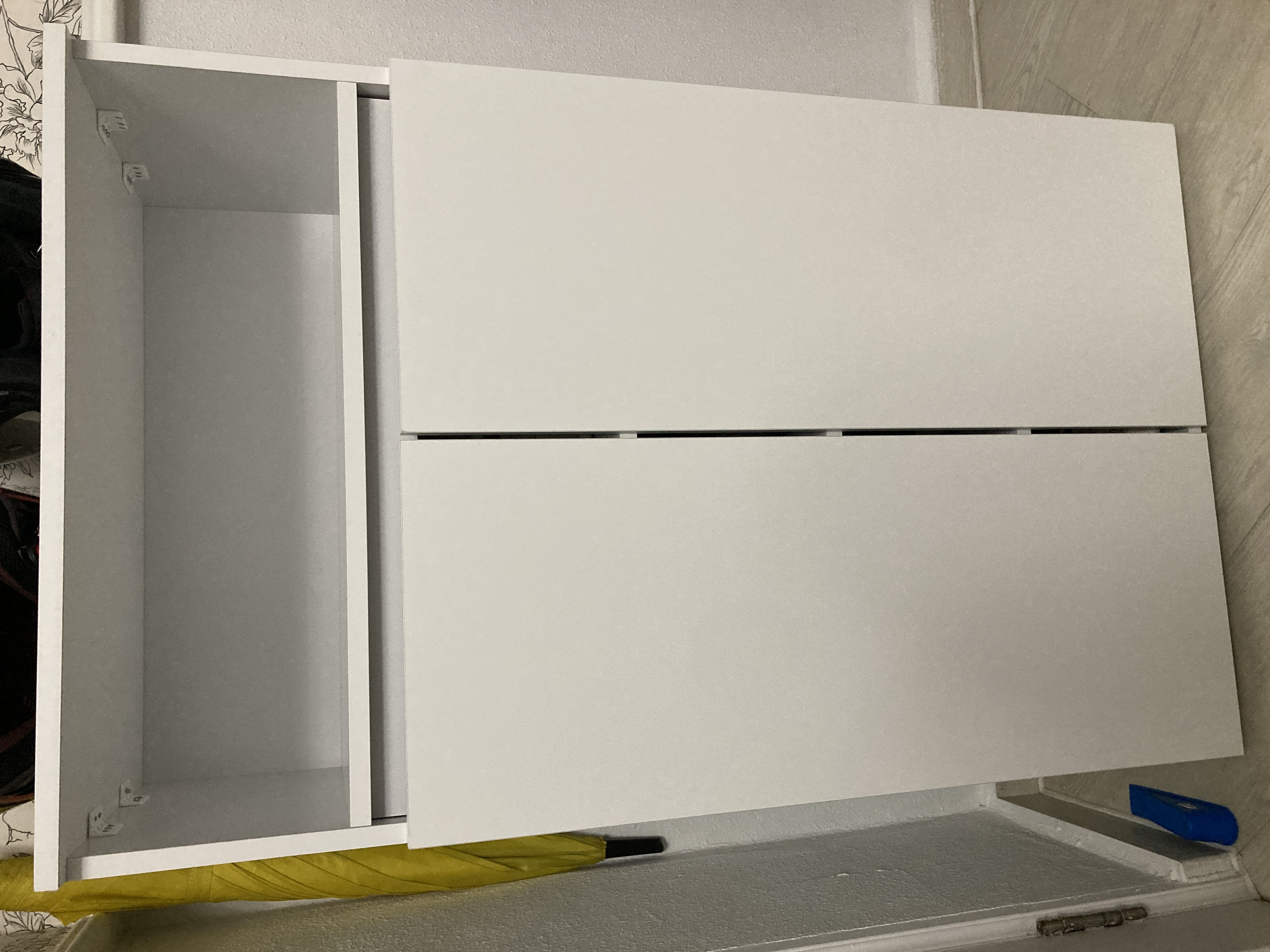 Customer home photo 10: The size is suitable to place behind my front door. Need to organise in order for more shoes space. Price is okay, but not sure if the white color will turn into yellowish over the time.