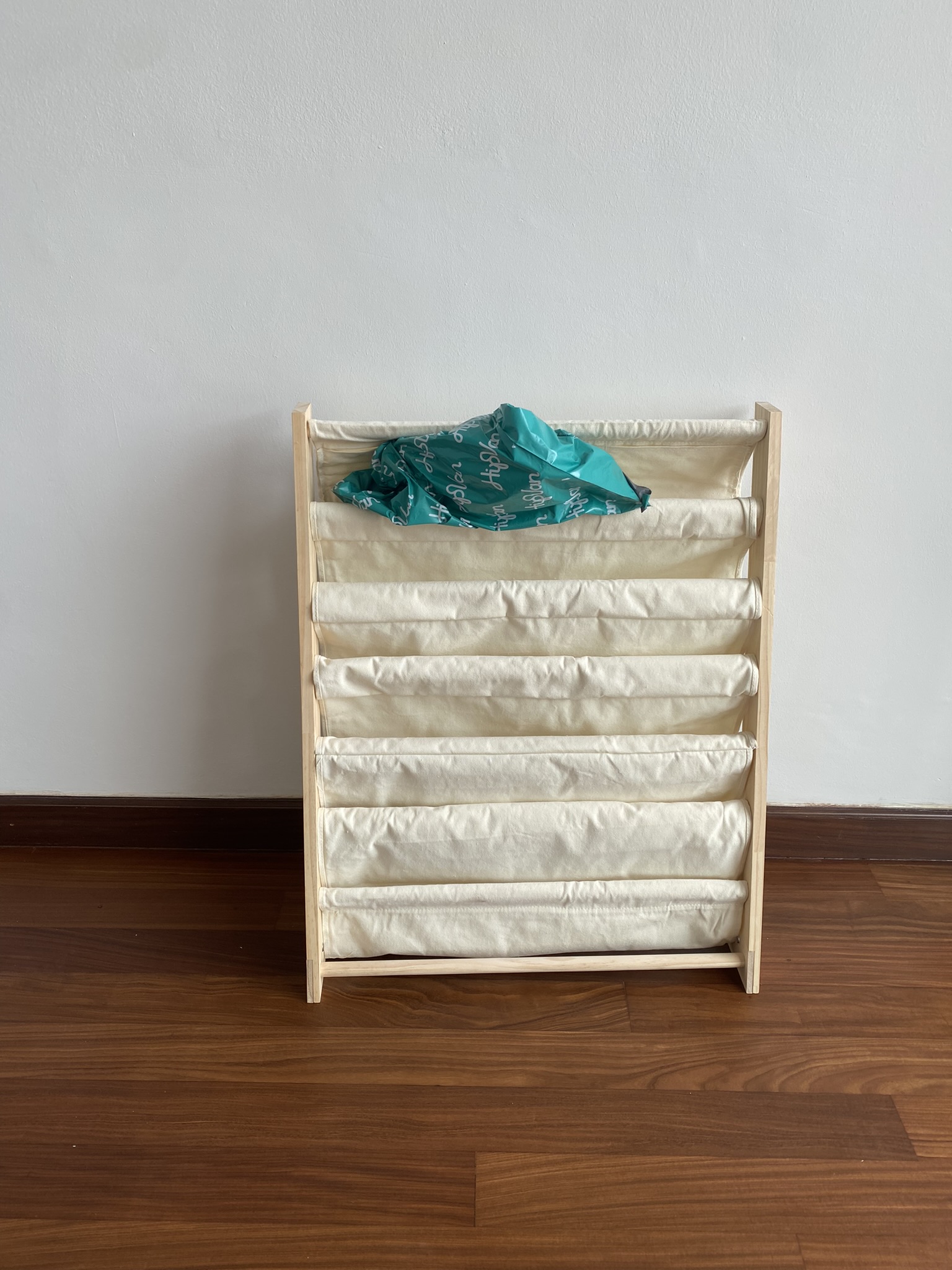 Customer home photo 2: It was assembled quickly for me and quality is good. Only thing is you’d need to dismantle the whole thing in order to wash the fabric. Overall it is a good buy.