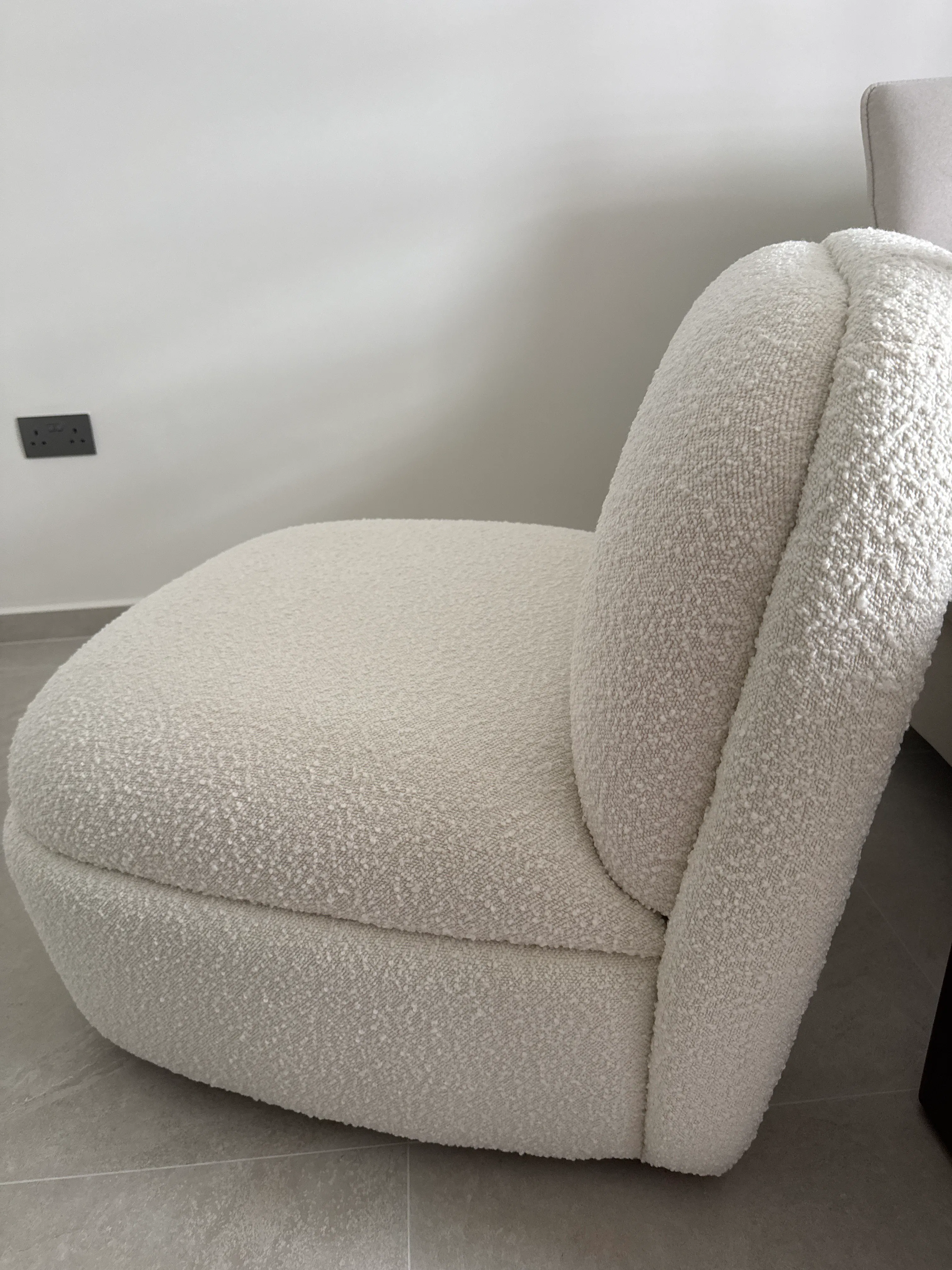 Customer home photo 1: The material is nice and soft. Feels comfy and sturdy. The swivel is just right, not too smooth not too rigid.