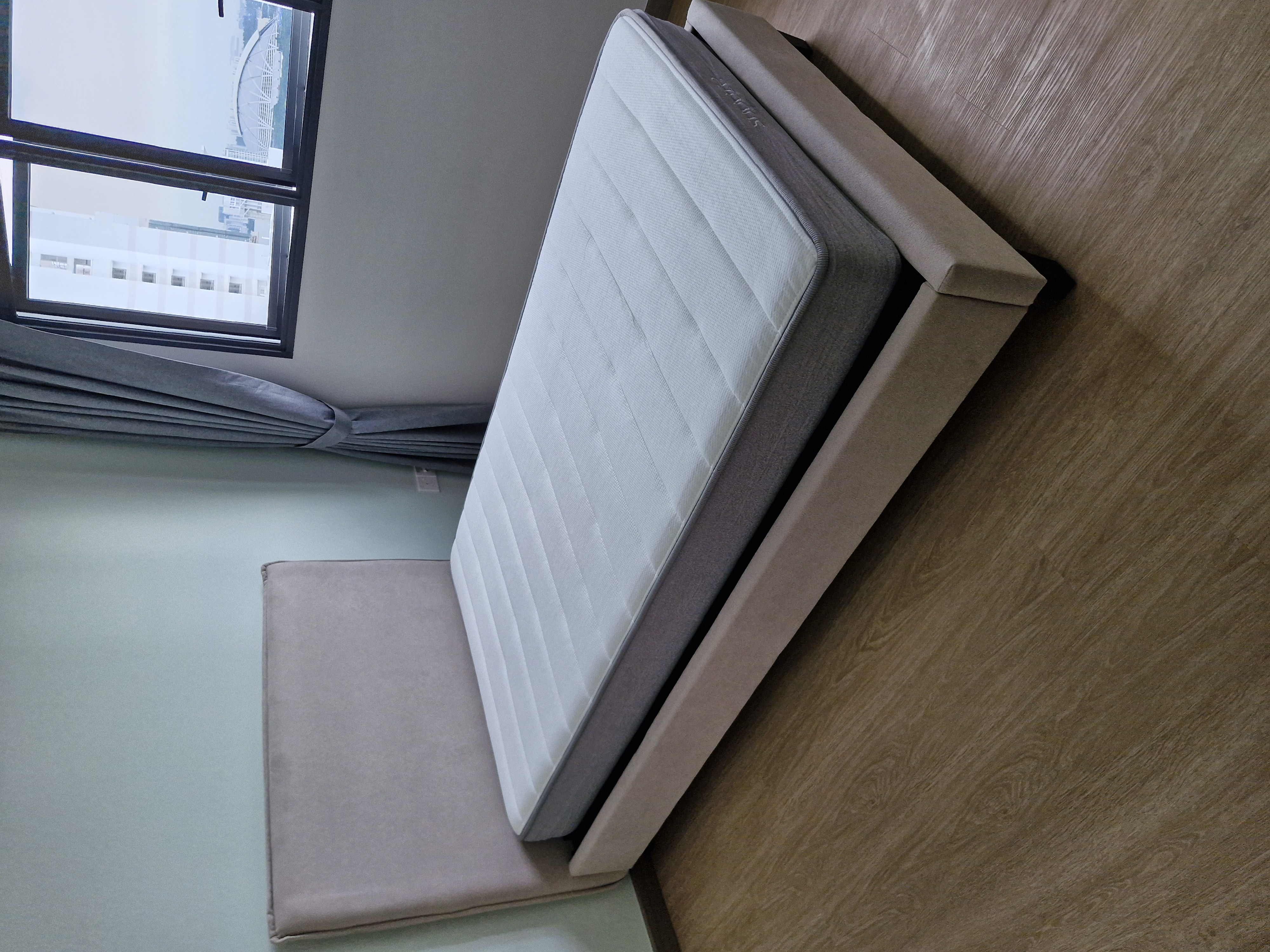 Customer home photo 1: The delivery was punctual and installation was efficient. Bed look nice . Have not tested yet. Item is light as I can push it easily to my preference.