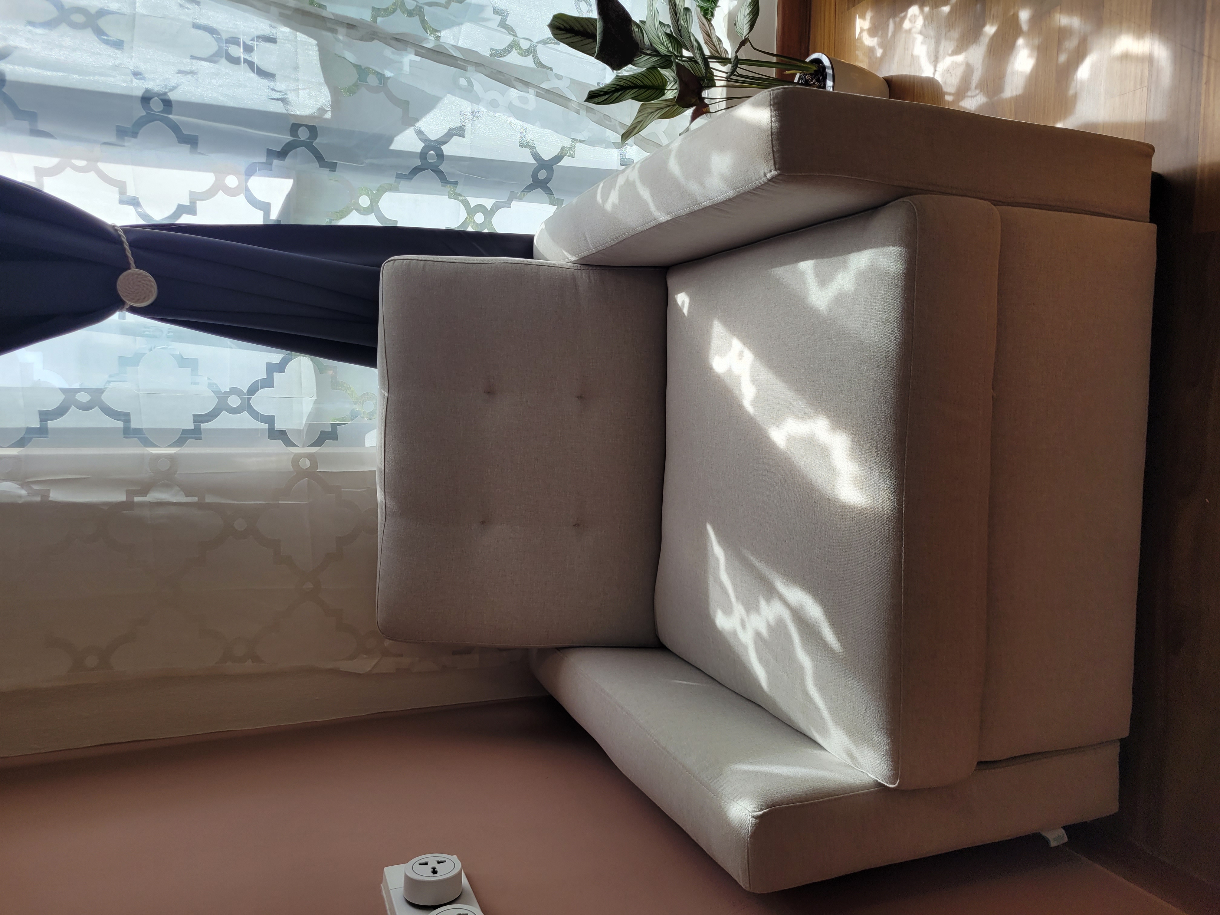 Customer home photo 2: I like the quality of the material its smooth to touch and not rough compared  to some sofa bed I check around. Its easy to make it into sofa bed.