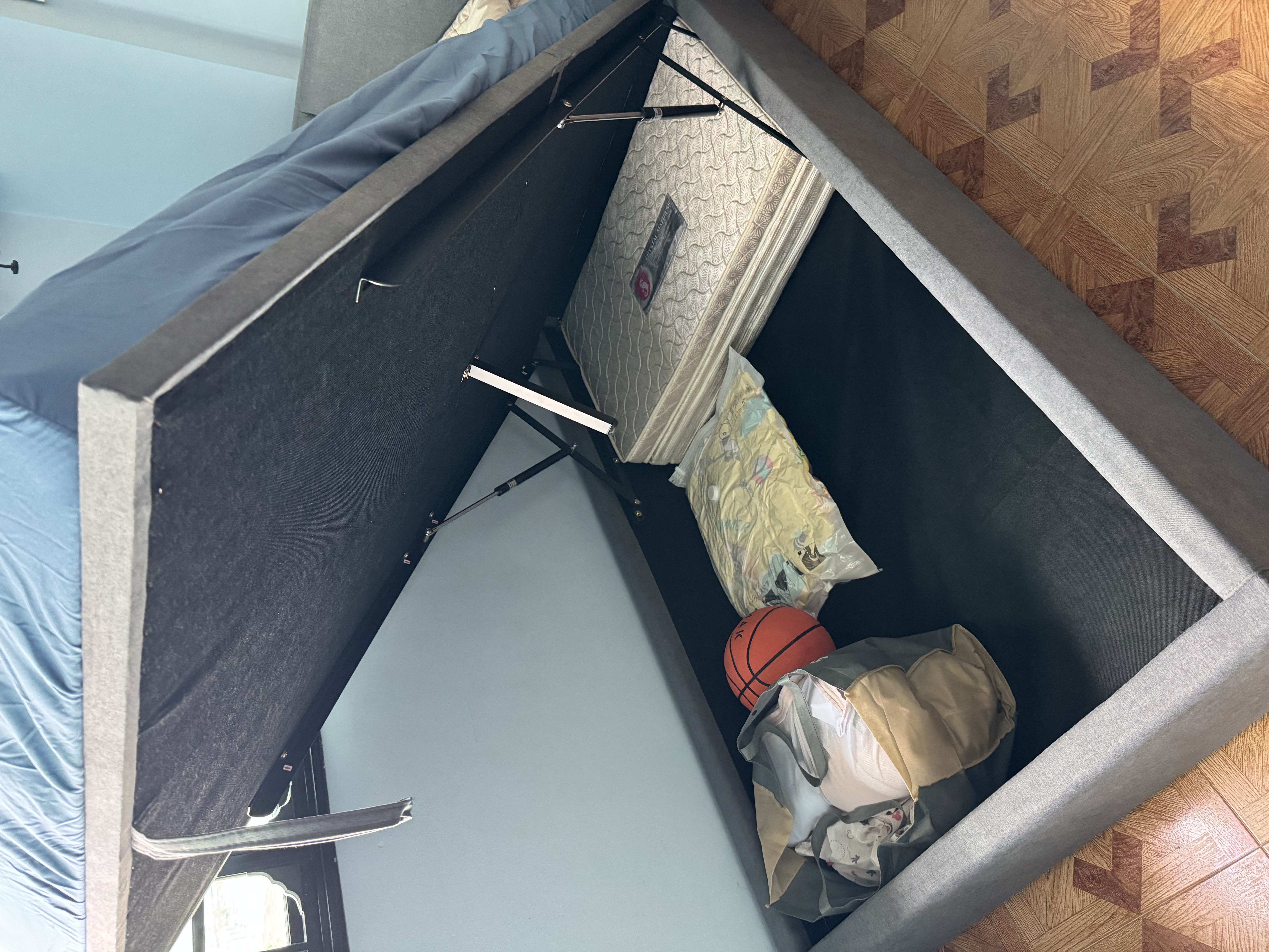 Customer home photo 10: Bought this bed for my son and he loved it! Save on space with the storage but was surprised there’s no plank underneath and just using a fabric to cover the bottom.