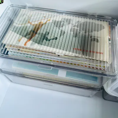 Customer home photo 2: Material seems hardy but the top is not lock-fit kind. it's just close and sit on top type. I use to keep my collection of first day covers and expect that it will be easy to clean the box with wet wipes/damn cloth and keep the content dust free. It stacks nicely.