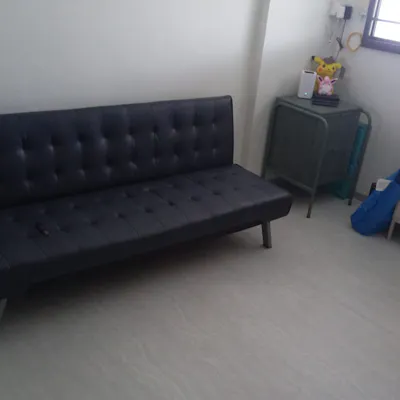 Customer home photo 6: The price is cheap and the quality is good. Color wise is a bit different as it's not exactly grey as how one can imagine but it's gonna look like dark blue. Usage wise is useful for when I have a few guests coming over as the back rest can be brought down for guests to sit all around it. Size is just nice for my 3 room flat hall. Just need to be careful as there is no support in the middle so if u have heavy guests sitting in the middle u can feel the sofa will bend a lil coz of the weight. Not an issue just a simple observation by me. Overall satisfied with the product.