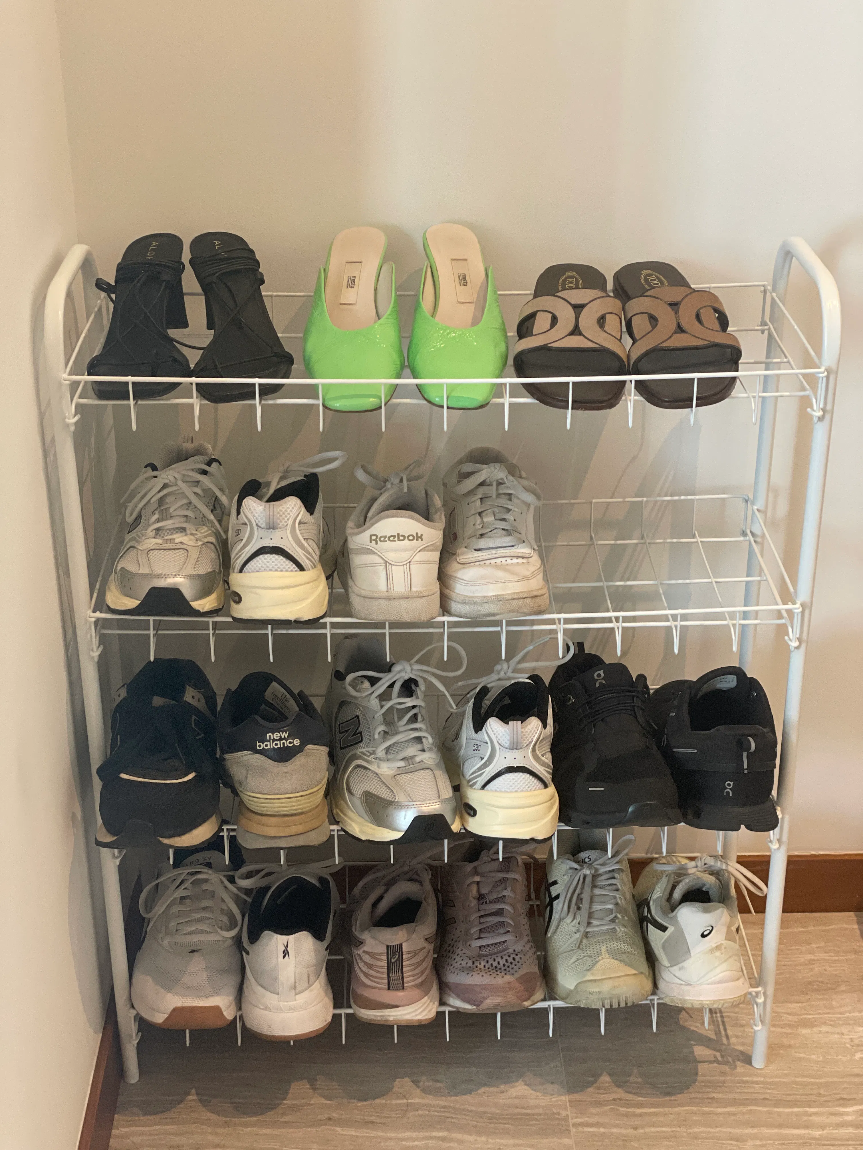 Customer home photo 1: Good storage option! But does not comfortably fit 3 pairs on each row…