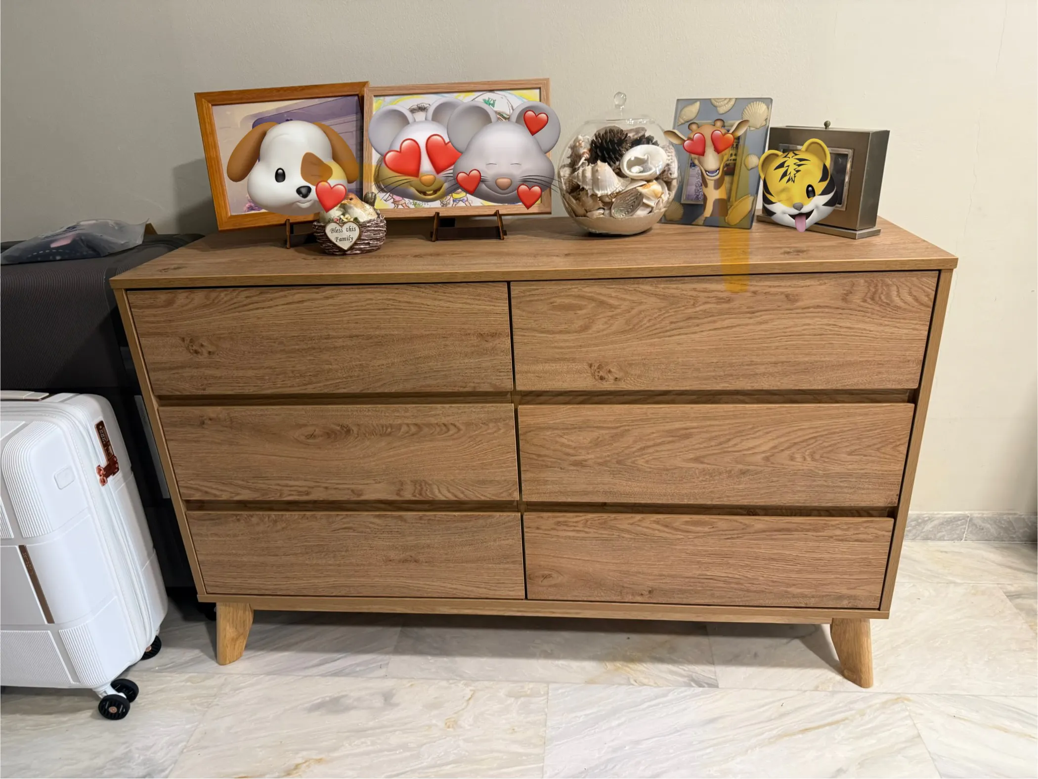 Customer home photo 3: This drawer chest looks great in my living room — the natural wood finish gives a warm, cozy vibe and the quality feels sturdy and well-built. Love that the drawers are spacious and glide smoothly. Definitely a functional and stylish addition to the space!