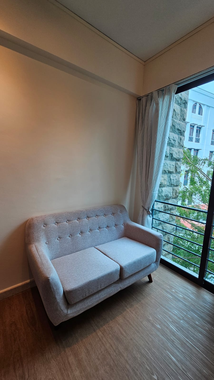 Customer home photo 1: I bought this sofa based on reviews from other users.  No regrets as it feels comfortable with a nice firm seating.  I do not mind the back being less cushiony as it can be easily resolved with some add-on cushions. Seat height is a good height given I am 1.71 m tall.