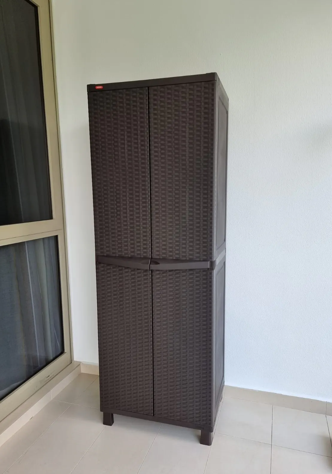 Customer home photo 2: Placed Keter outdoor cabinet in my balcony to store iron board, and laundry stuff in my new condo.  Used Keter products before, thus have faith in its quality and durability .