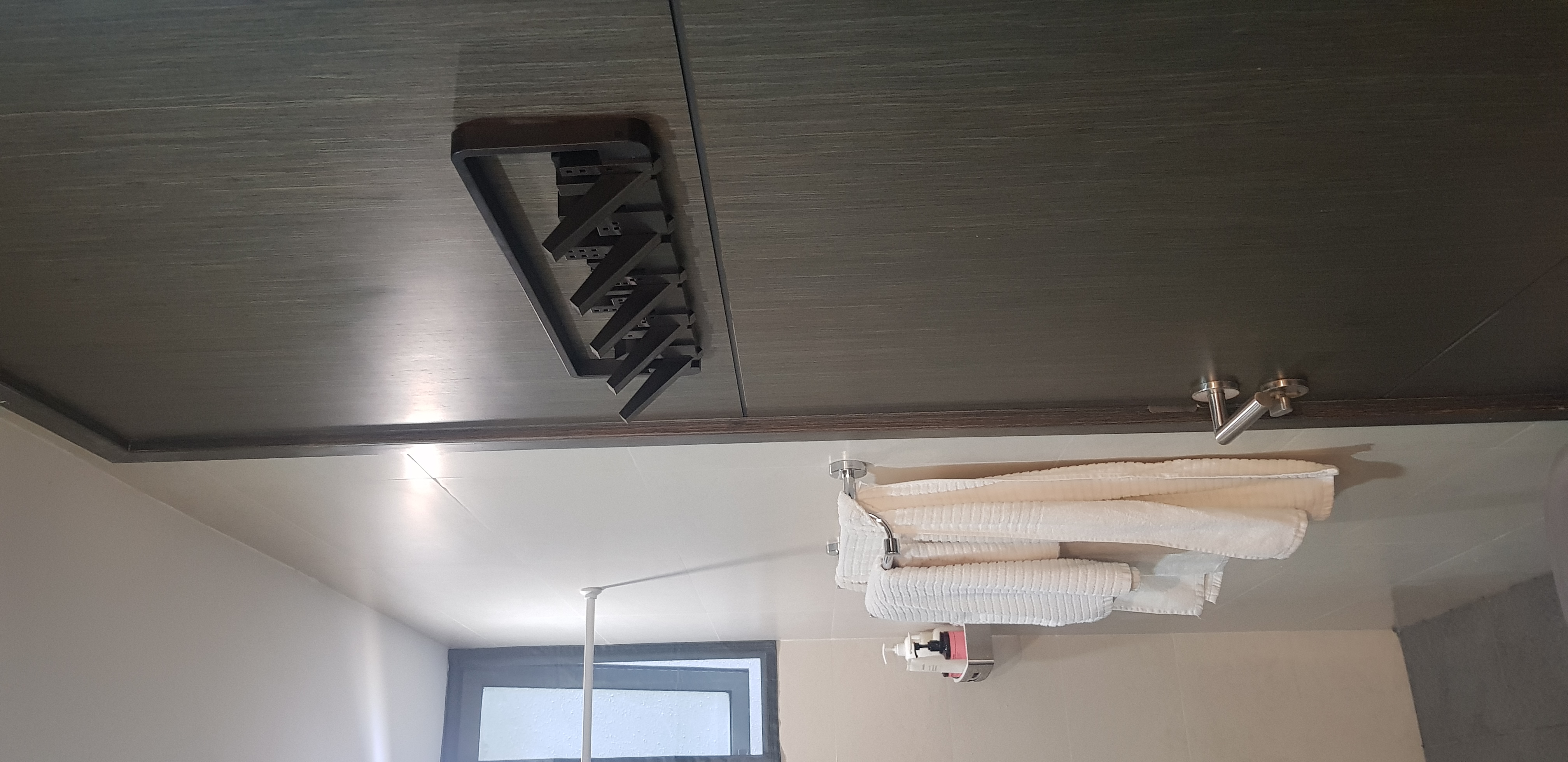 Customer home photo 3: The multi-hook is a stylish way to accent my bathroom, and for all the needed change when we're zipping in and out.