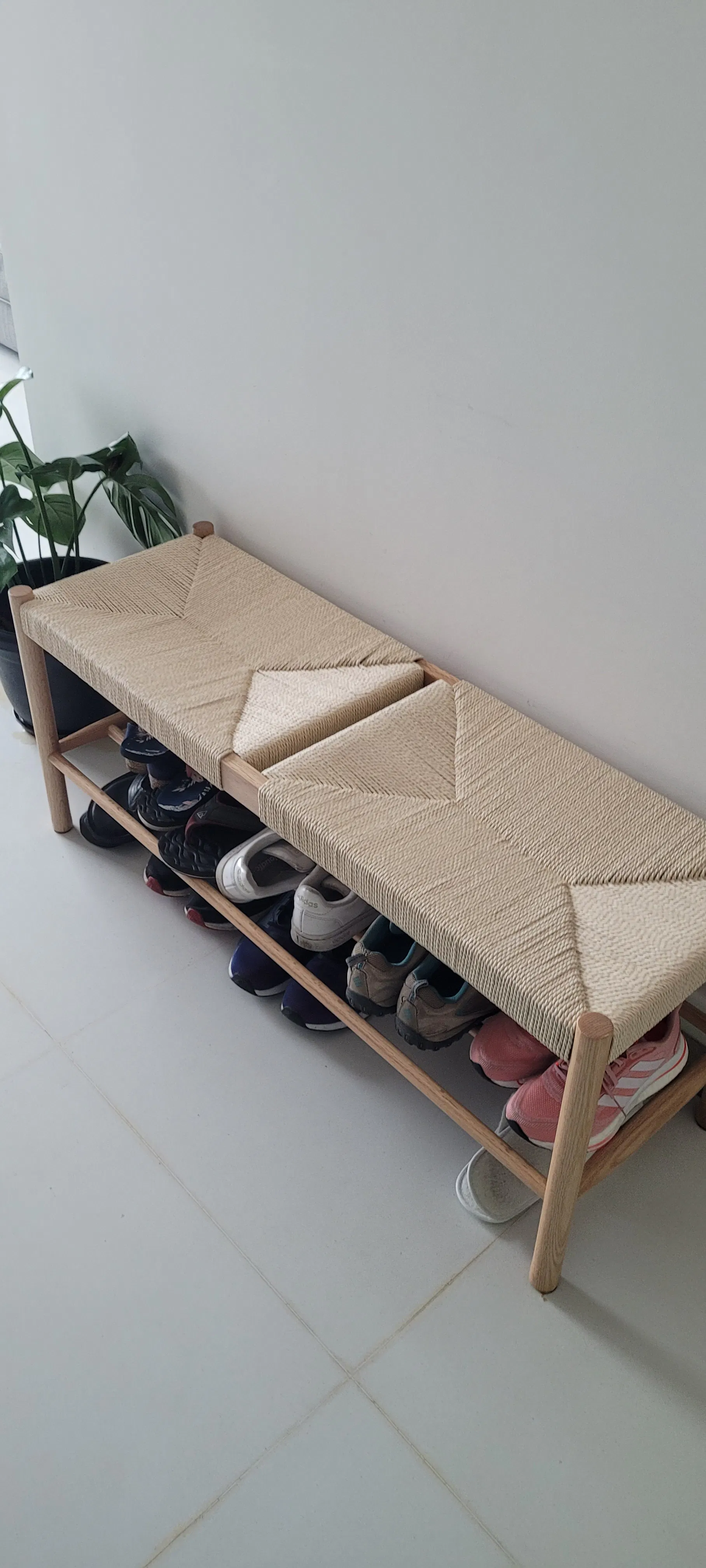 Customer home photo 10: Love this piece at the front door. Holds and hides a bunch of shoes and will also act as a personal rest. Good to toss your keys, mail or groceries as well. Comes fully constructed.