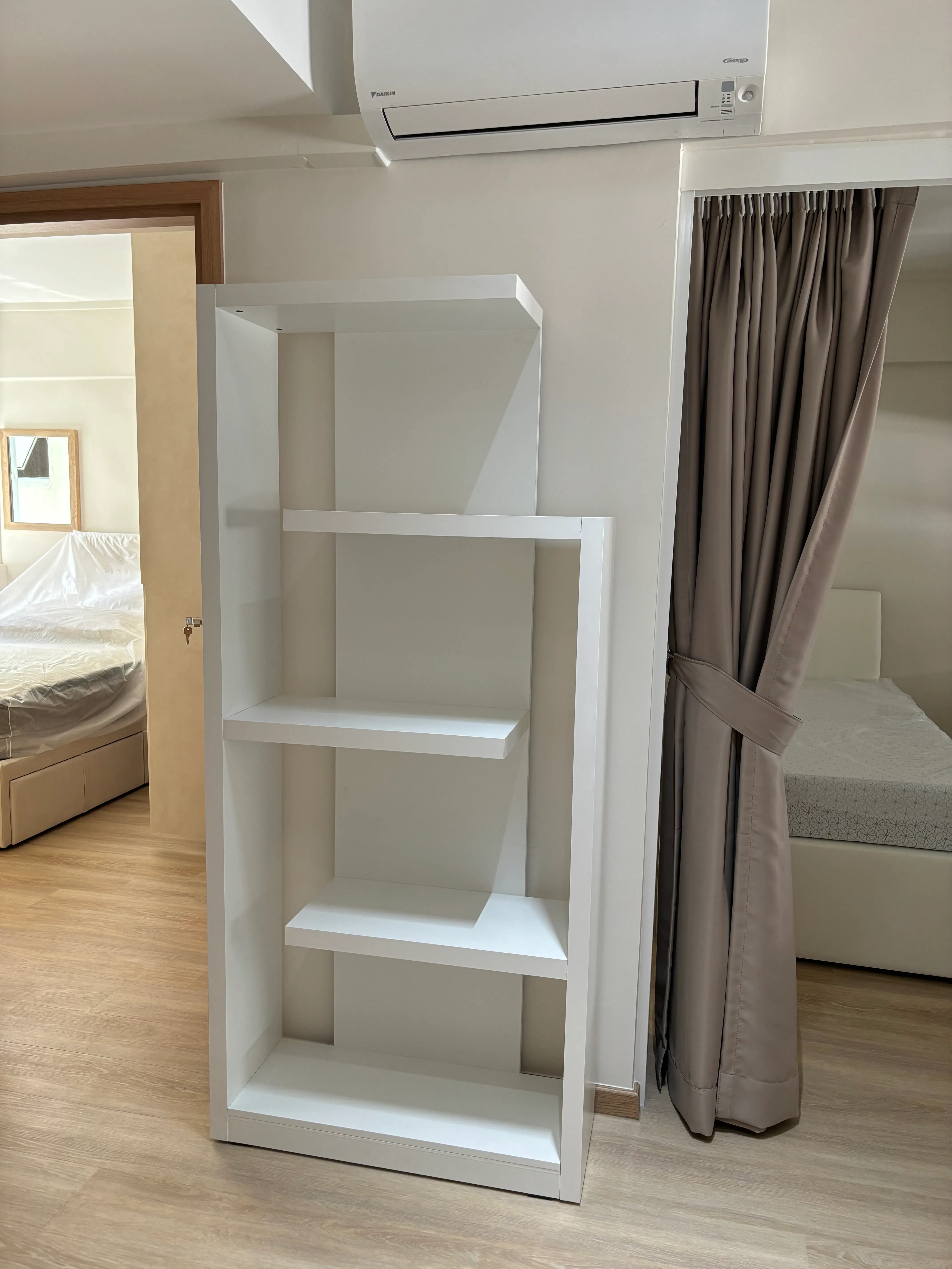 Customer home photo 2: Beautifully designed bookshelf that fits into minimalist/scandinavian themes. It is quite sturdy too. Deliveryman/installer was very professional.