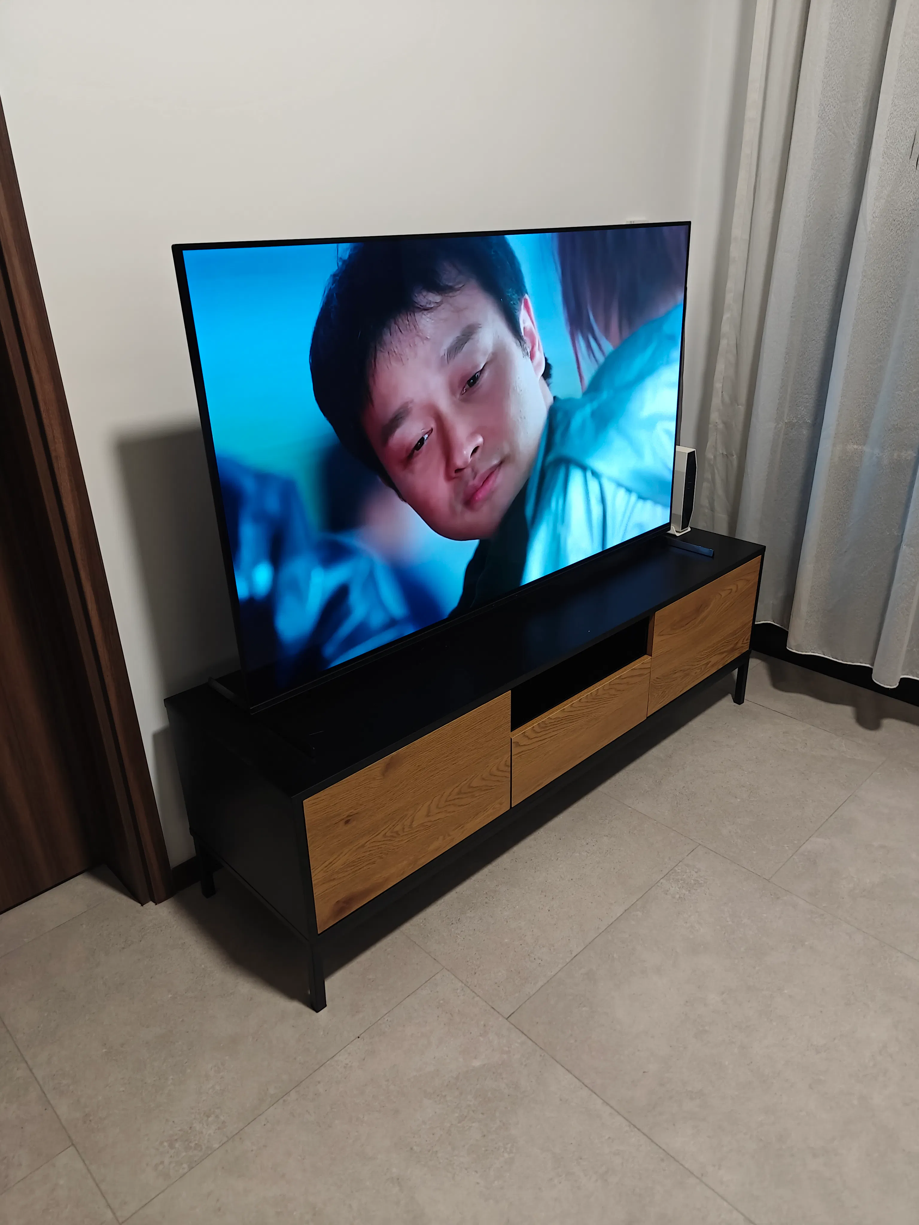 Customer home photo 1: Study and fits my space and 55 inch TV just right. Workmanship especially the fit of the door could be better.