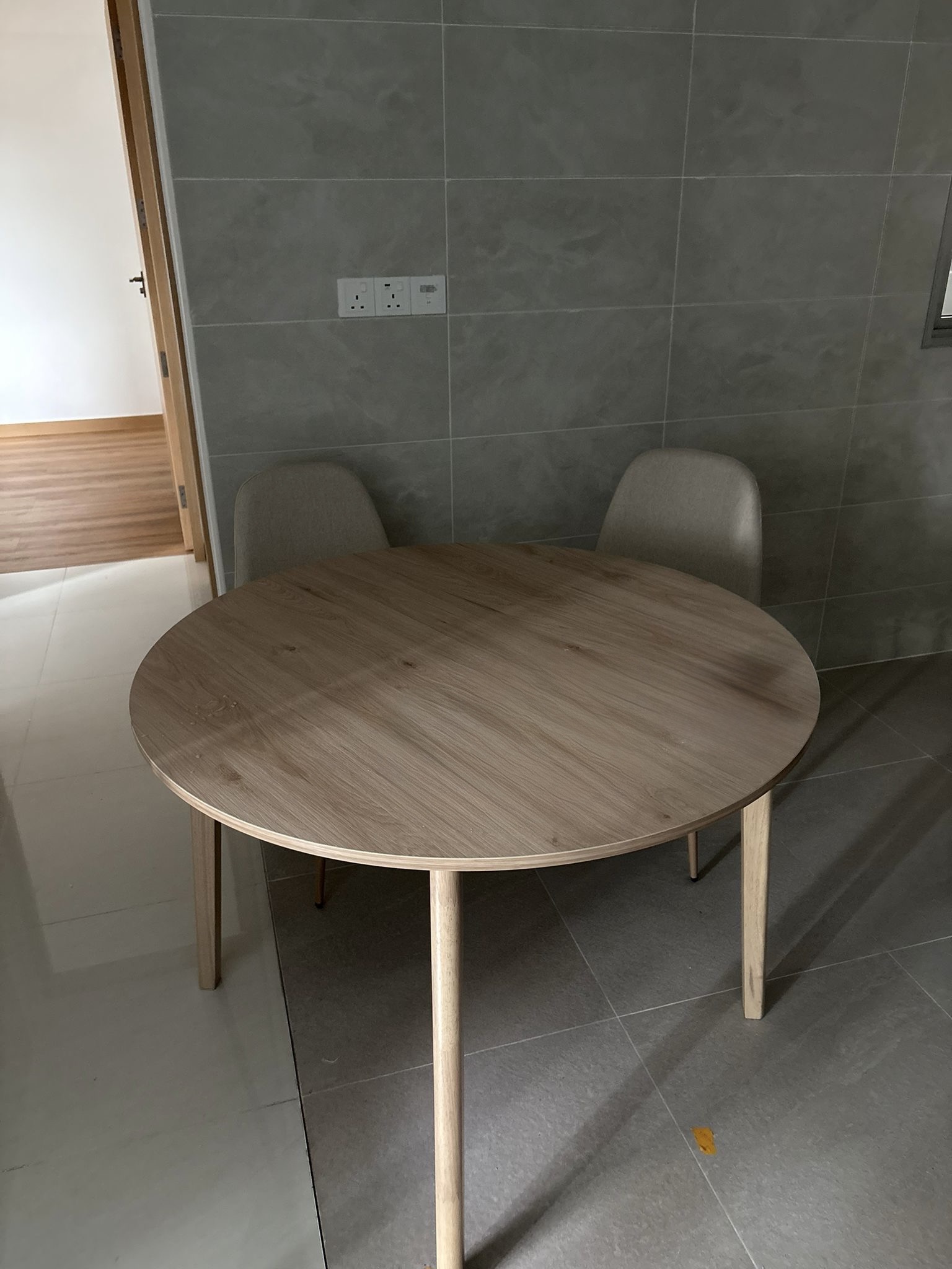 Customer home photo 1: For this price, I was surprised by the quality of the table. It was a bit dusty but nothing a bit of water and soap can’t fix.