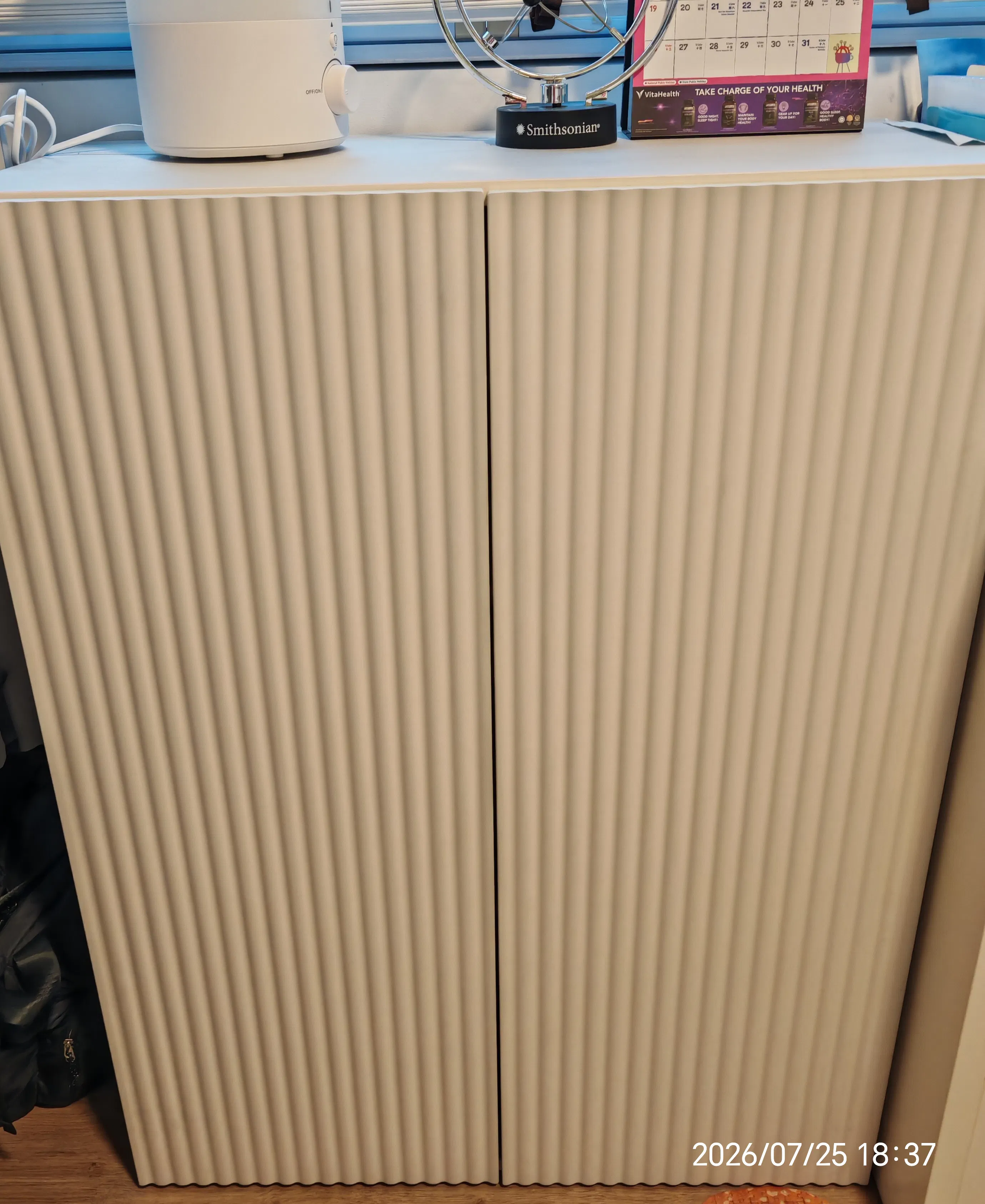 Customer home photo 4: Ordered the white. Dimension of this fits nicely into the space. Shelving height can be adjusted accordingly. Simple design but classy and spacious! Prefixed before delivery.